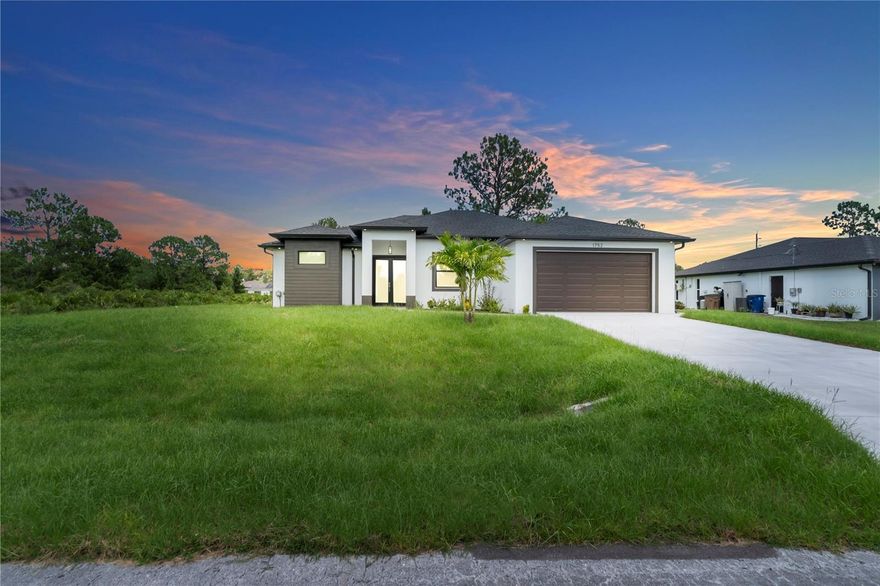 Brand New Construction – Completed in 2025! Experience the perfect blend of modern design and outdoor living on this spacious 0.5-acre lot in rapidly growing Lehigh Acres. This move-in-ready 4-bedroom, 3-bath home offers 1,912 sq ft of stylish living space, featuring Soaring Ceilings, elegant tile floors, quartz countertops, and stainless steel appliances. The open-concept layout flows seamlessly into a large covered terrace—ideal for outdoor cooking and weekend BBQs. Enjoy spa-style bathrooms with frameless glass showers and high-end finishes throughout. A must-see opportunity!!!