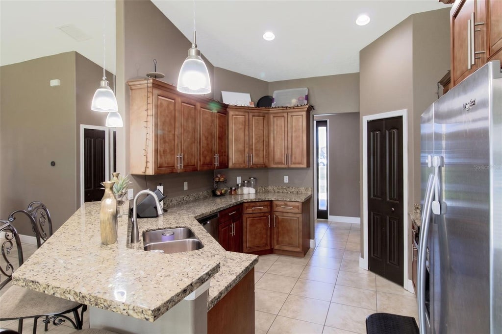 Photo of 1438 SW Devera Avenue, Port Saint Lucie, FL 34953 (MLS # O6452485)