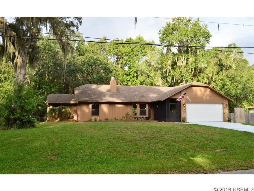 Under contract taking backups. You will love this large renovated 3/3 on the very last street in Florida Shores w/ only woods behind you for extended privacy on a high 3 lots parcel . This home has a large open floor plan w/ 2 master suites, one with full bath, one with 1/2 bath and extended sitting area. Could make for a nice in-law qtrs. New paint inside and out, large roomy kitchen with new Stainless Steel appliances and breakfast bar, newly renovated baths and 2 car garage too. You will really enjoy the large backyard deck area that extends the length of the home w/ a portion open and a portion screened. Move in ready for family or retirees at an affordable price. This is a lot of home for the money. Seller will contribute $2500 toward Buyer closing costs. ;Water: City
