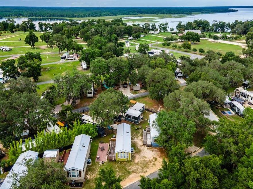 Charming Retreat Near the Ocala National Forest – 15991 NE 243 Place Rd Unit 31, Fort McCoy, FL 32134 Offered at $120,000 | 1 Bed | 1 Bath | 492 Sq Ft Discover peaceful, low-maintenance living in this inviting 2006 mobile home located in the scenic KOA Oklawaha Campground. Whether you're looking for a full-time residence, seasonal getaway, or a short-term rental investment, Unit 31 offers comfort, value, and access to endless outdoor recreation. This 492 sq ft home features 1 bedroom, 1 three-fixture bathroom, an open-concept living area, built-in kitchen, and a spacious wood deck perfect for outdoor relaxation. Recent Upgrades & Maintenance (High-Value Improvements): - New roof, floors and siding (2024) - HVAC system repaired (2024) - Shower leak professionally repaired (March 2025) - Additional ground strapping installed (county code prior to current ownership), adding extra stability and safety Community Amenities: Enjoy resort-style amenities in the KOA campground including: - Swimming pool, clubhouse, and dog park - Playground, volleyball, corn hole, and beach area - ATV riding trails and scenic nature paths leading to a lake overlook Family-friendly atmosphere with activities for all ages Prime Location: - Minutes from downtown Fort McCoy: grocery store, doctor, pharmacy, gas, hardware, and pizza delivery - 30 miles to Ocala for additional shopping, dining, and medical care Near lakes, springs, and Ocala National Forest for fishing, hunting, hiking, boating, kayaking, and ATVing ?? HOA includes electric, water, sewer, trash, and full access to amenities. Whether you're looking to relax, explore, or invest, Unit 31 is a rare opportunity to own an updated, move-in-ready home in one of Central Florida’s most active outdoor communities. Schedule your private showing today!