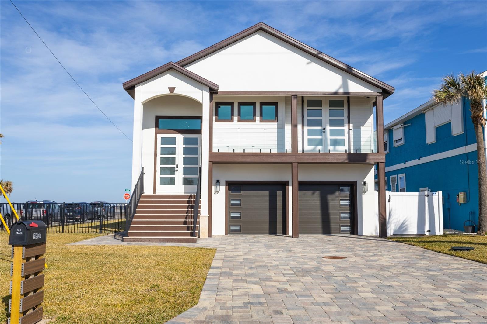 This stunning oceanfront home, located on a prime corner lot in Flagler Beach, offers unparalleled views of the Atlantic Ocean and is just steps from the beach. Enjoy expansive ocean views for miles and the soothing sound of the waves. This property provides the perfect coastal retreat. The spacious interior features 2 generous bedrooms with a full bathroom downstairs. Outside, the home boasts an inviting gas-heated pool and spa, along with a newly added outdoor summer kitchen, a gas fireplace, and two outdoor showers, all within a private, fenced backyard—perfect for pets and outdoor gatherings. A remodeled kitchen upstairs features quartz countertops, white gloss melamine cabinets, and top-of-the-line Thor kitchen appliances. The open-concept layout seamlessly connects the kitchen to the dining area, making it ideal for both daily living and entertaining. The back balcony has been extended to 12 feet, providing even more space for relaxation and entertaining while enjoying the stunning ocean vistas. The master suite is a tranquil retreat, with a luxurious en suite bath that includes a large walk in shower, a relaxing tub, dual vanities, and plenty of closet space. Extensive renovations throughout the home include a new roof, impact-resistant doors and windows, new AC units, and brick pavers in both the front and back. Inside, the home features new tile throughout the home, newly remodeled bathrooms, custom closets, 8-foot interior doors, fresh paint and trim, zebra shades, modern lighting fixtures and ceiling fans. This home is also equipped with smart home technology, offering Alexa compatibility for easy control of lighting, temperature, and more. Located close to local restaurants and shopping, this oceanfront gem blends luxury, comfort, and convenience, making it the perfect place to call home. Don’t miss your chance to own this exceptional Flagler Beach property—schedule a showing today!