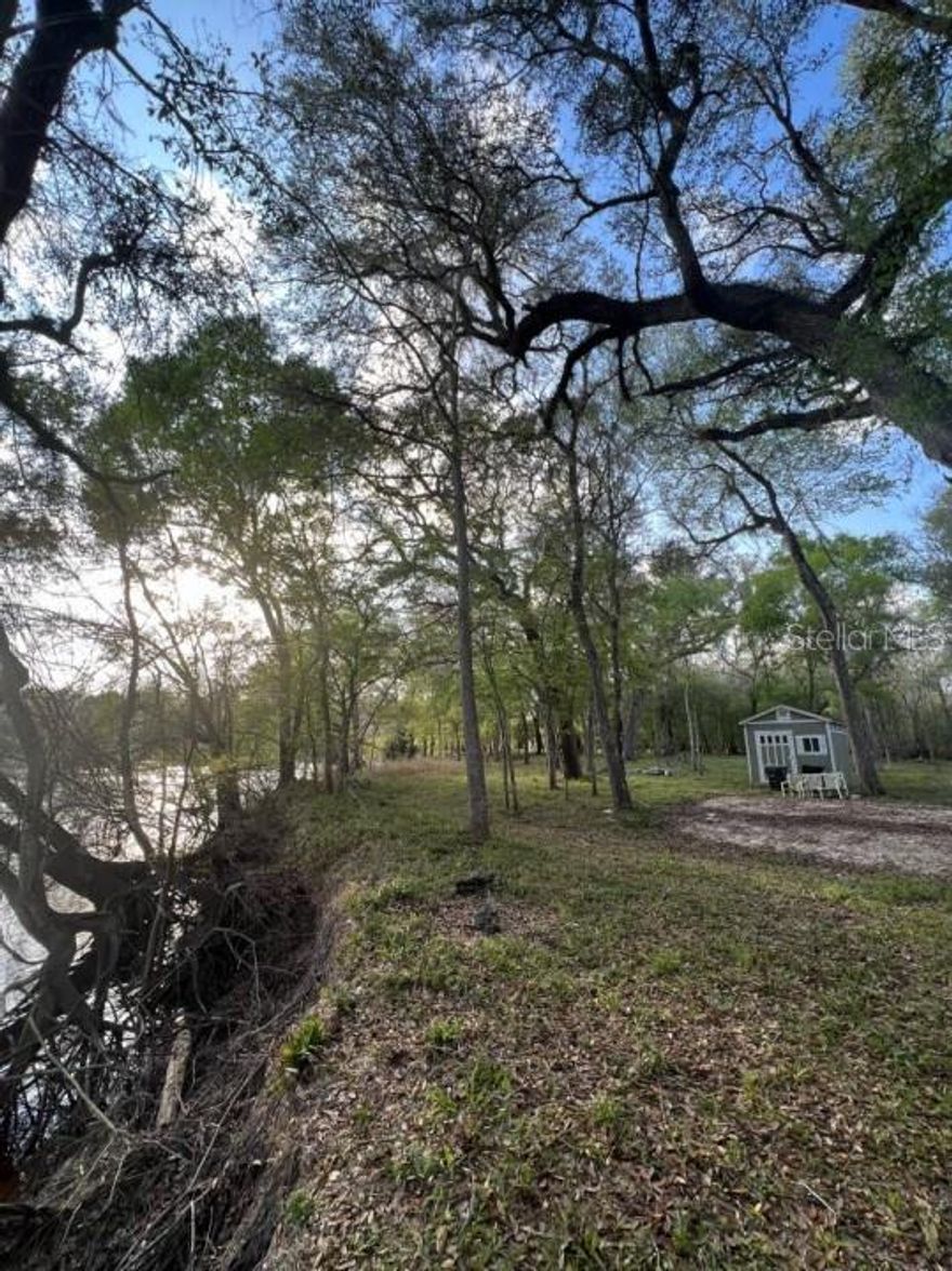 6.14 TOTAL ACRES - 2 Parcels (4.04 Acres + 2.10 Acres) for sale TOGETHER for one price. Lots 32, 33 and 34 Suwannee Landing, with 411 ft. Suwannee River frontage. Active ELECTRIC, WELL and SEPTIC. Nice utility STORAGE BUILDING. Each lot has high bank riverfront, upland area and cypress slough. Camp or build to suit. Visit beautiful freshwater springs in both directions, or boat down to the Gulf!
Parcel ID 30-08-14-0064-0000-0330  is  lots # 33 and 34 Suwannee Landing, 4.04 acres, and Parcel ID 30-08-14-0064-0000-0320 is lot # 32 Suwannee Landing, 2.1 acres.