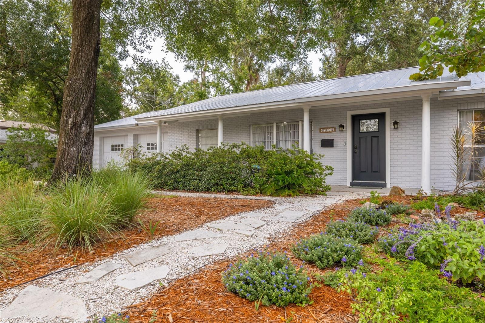 Under contract-accepting backup offers. Welcome to this charming 3-bedroom, 2-bathroom home with a 2-car garage, situated on a spacious corner lot in the heart of Town 'N Country! As you arrive, you'll be greeted by a large covered front porch—perfect for enjoying your morning coffee or relaxing in the evenings. Step inside to discover beautiful luxury vinyl flooring throughout and a welcoming living and dining room combination ideal for entertaining. The kitchen features freshly painted cabinets, durable composite countertops, tile flooring, a closet pantry, breakfast bar, and a cozy breakfast nook. Just around the corner, the family room offers a comfortable retreat with sliding glass doors that open to the fully fenced backyard—complete with a patio area and a utility shed for extra storage. The primary suite includes dual closets and a private en-suite bathroom with a separate water closet and a walk-in shower adorned with floor-to-ceiling tile. The two additional bedrooms are spacious with built-in closets and are filled with natural light from the home’s large windows. The beautifully renovated common bathroom adds a fresh, modern touch, perfect for guests and family alike. Located just two blocks from the Town 'N Country Greenway biking trail, this home offers easy access to outdoor recreation while still being close to schools, shopping, and dining. Don’t miss the opportunity to make this home yours, schedule a showing today!