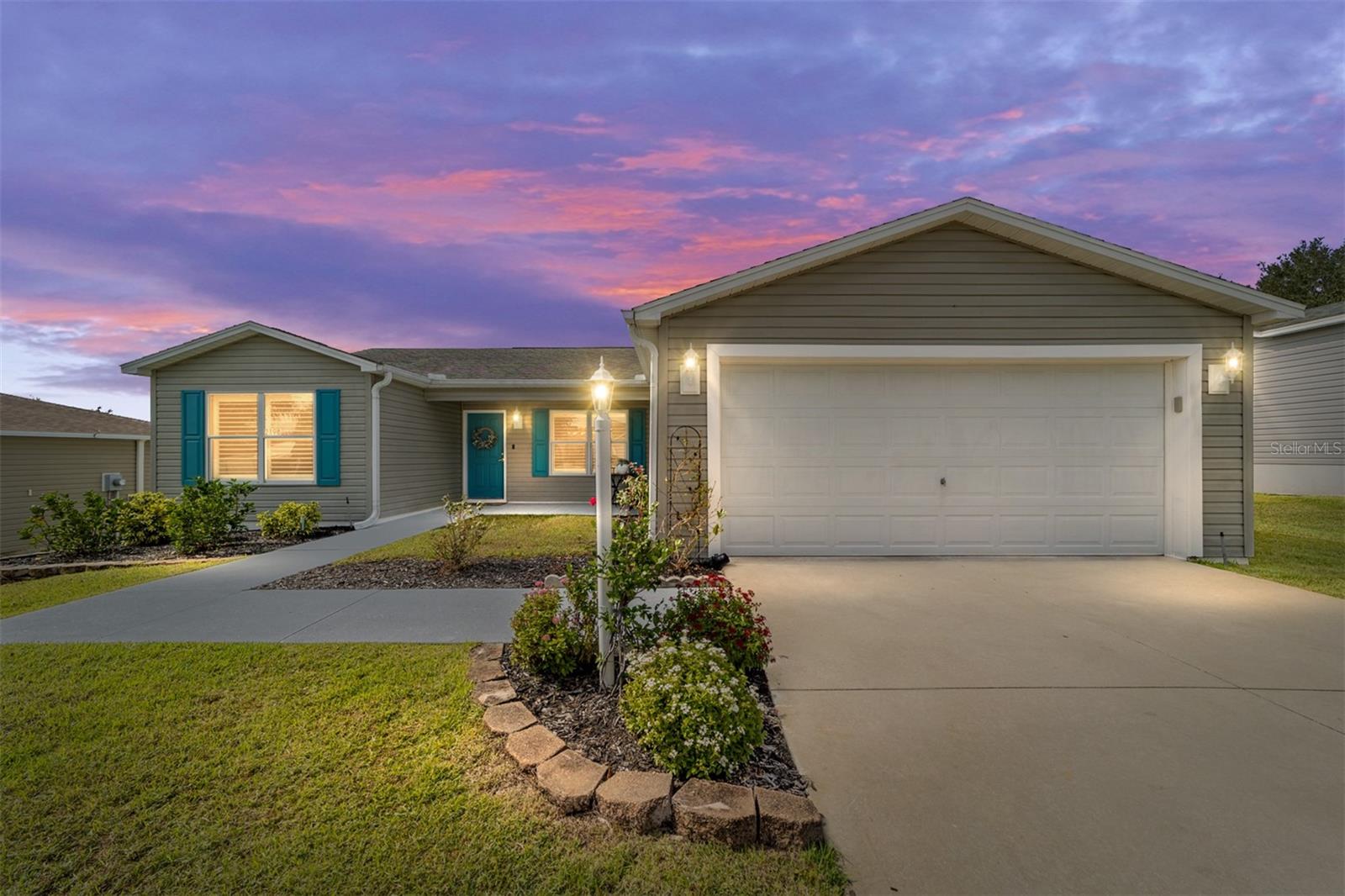 Coastal-Inspired Amarillo in Prime Amelia Location! Step inside this charming Amarillo model in the highly desirable Village of Amelia—perfectly positioned halfway between Brownwood Paddock Square and Lake Sumter Landing, and just minutes from Colony Plaza’s grocery, banking, dining, and everyday conveniences. NEW ROOM COMING!  This 3-BEDROOM, 2-BATH home lives bright and airy with an OPEN FLOOR PLAN, abundant NATURAL LIGHT, and VAULTED CEILINGS with modern knockdown texture (no popcorn). Luxury Vinyl Plank flooring flows throughout, complemented by UPDATED LIGHT FIXTURES for a clean, stylish look. The kitchen stands out with STAINLESS STEEL APPLIANCES, modern OPEN SHELVING, QUARTZ COUNTERTOPS, a BUTCHER BLOCK-Topped ISLAND, shiplap range hood, and TILE BACKSPLASH. The PRIMARY BEDROOM offers generous privacy, while the EN-SUITE BATHROOM features GRANITE COUNTERTOPS, TILE FLOORING, and a LOW-MAINTENANCE SHOWER. Guests will appreciate the UPDATED bath with QUARTZ counters and tile accents. Enjoy INDOOR LAUNDRY in the mud room, a 2-CAR GARAGE for storage and vehicles, and a SCREEN-ENCLOSED LANAI with NO “kissing lanais” for enhanced PRIVACY. Located less than a minute from two neighborhood pools and steps from the Duval Family Recreation Center offering PICKLEBALL, TENNIS, BOCCE BALL, BILLIARDS, a FAMILY POOL, and more. A beautifully styled home in an unbeatable spot—ideal for anyone ready to dive into The Villages lifestyle at a smart value!  Low Bond Balance of $10,898.