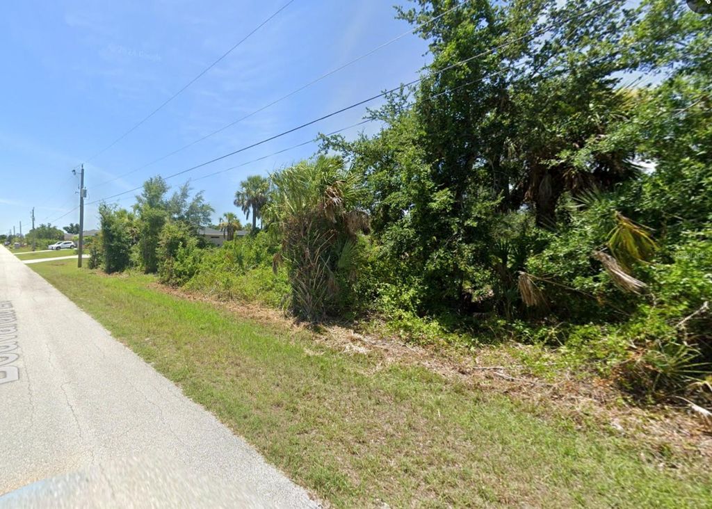 Photo of 13331 Bouvardia Lane, Port Charlotte, FL 33981 (MLS # O6372174)