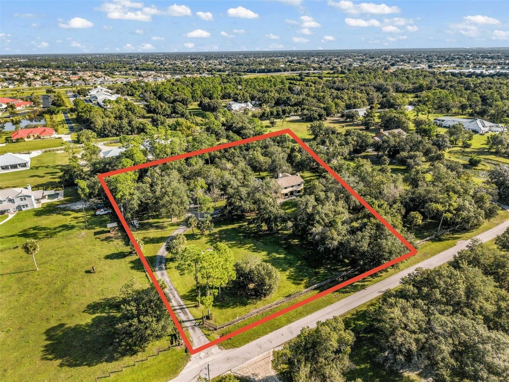 Photo of 24518 Tangerine Avenue, Port Charlotte, FL 33980 (MLS # C7531343)
