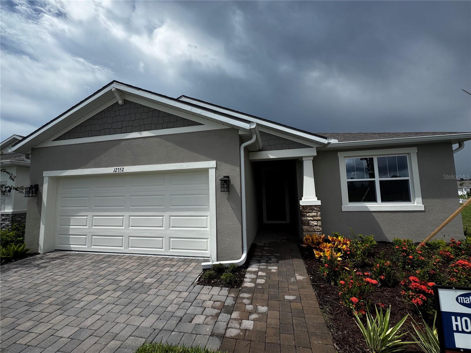 Welcome to The Gateway, an elegant Craftsman-style single-family home nestled in the upscale gated Windwater community of Parrish, FL. This brand-new residence offers a thoughtful and modern living experience with 4 bedrooms, 3 bathrooms of 2,209 sq?ft of Living Space. Gourmet Kitchen Equipped with all included appliances, featuring 42? Barnett Painted Harbor cabinets and luxurious Carrara Breve quartz countertops. Expansive Master Suite Retreat-style master bedroom with a glamorous ensuite bathroom including dual-sink raised vanity, glass-enclosed shower, and generous closet space. Convenient laundry room fully equipped with washer and dryer. Enjoy access to community pool, playground, park, walking sidewalks, and gated security. HOA includes maintenance and recreational facilities.