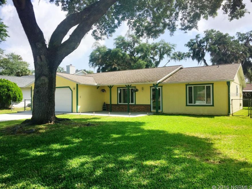 Adorable, immaculate, Florida Shores home. This home boasts a spacious split bedroom floor plan and large eat in kitchen that looks out from sliding doors and lead out to a large fenced in back yard that is perfect for a family with little ones and also comes with a storage shed.    AC was replaced in 2012.  The 2 car garage has a workshop and utility area.  Must see! ;Water: City