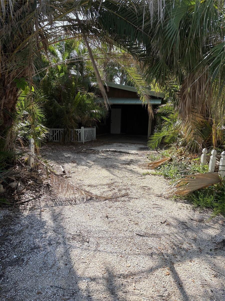 Large corner lot with small 930 square foot cottage that was Flooded and in need of redone, or torn down and start over.
27,882 square foot lot capable of splitting to have 2 building sites. 2 story homes can have water views across the road.
Lot is wooded so much privacy can be maintained.
House is hooked up to central water and private septic system currently.
Park in the driveway carport area for easy showings