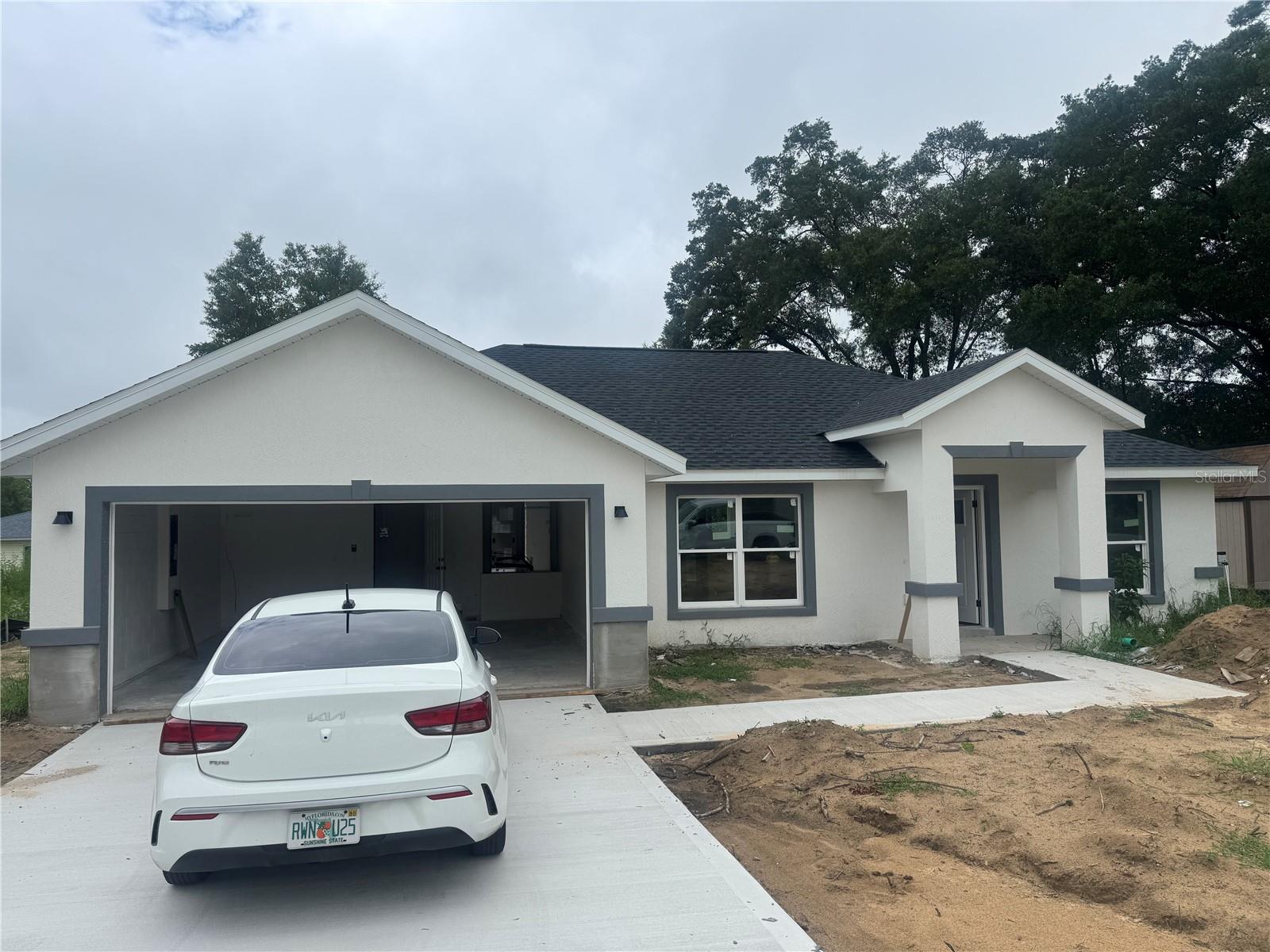 Fractional Ownership. Absolutely stunning lot 2025 NEW CONSTRUCTION home in Rainbow Ends Community in Dunnellon! This 3-bedroom, 2-bathroom home is impeccably updated and perfectly maintained. It boasts newly updated insulated vinyl windows, modern lighting, and ceiling fans. The kitchen showcases a newly updated island flat-top stove and refrigerator, solid new cabinets, solid stone countertops, and crown molding. This gourmet oversized kitchen is a breeze to keep pristine. The open floor plan at the living room make it the ideal spot for family gatherings. The spacious master bedroom features a walk-in closet.Conveniently situated near The Rainbow River State Park, as well as a wealth of restaurants and shopping options and walking distance to the Rainbow Ends Golf Course. Don't miss the chance to see this wonderful home today with NO HOA NO CDD READY to Move IN. Light and bright throughout, the interior is finished with stainless steel appliances, solid stone countertops in the kitchen/bathrooms, and luxury vinyl flooring throughout. Located just a few short minutes from the beautiful Rainbow Springs, where you can enjoy fishing, boating, camping and Golf and so much more. Floor-plan, interior and exterior colors, finishes, and garage orientation may vary for actual home. Information is deemed correct, but no guarantee made- dimension listed are approximate. Bring your offers!