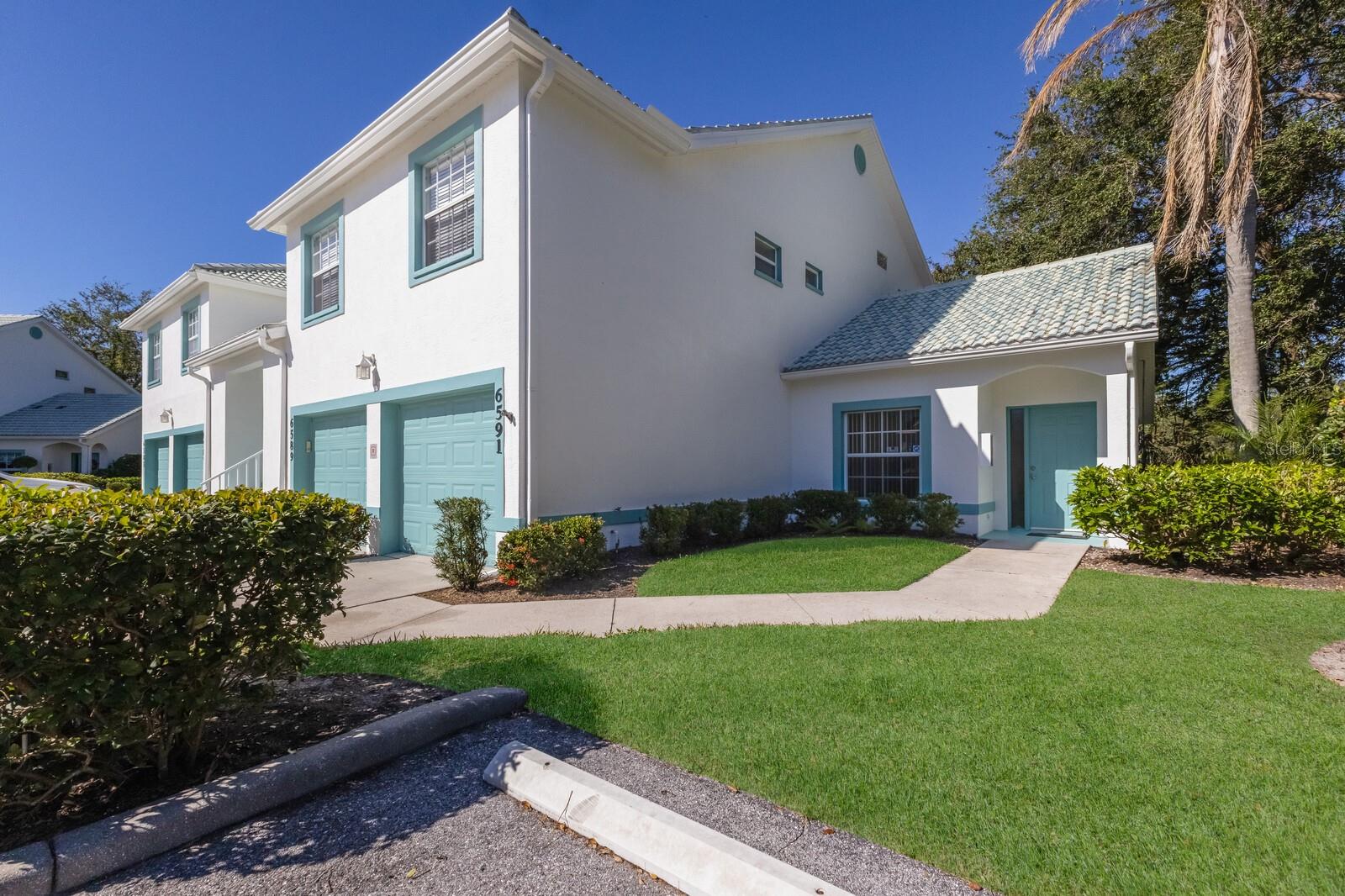 Welcome home to this charming and rare find - a maintenance-free condo nestled in a luxurious boutique golf course community, where membership is optional! This beautifully maintained ground-floor, corner unit offers a perfect blend of privacy and convenience. Step inside this freshly painted 2-bedroom, 2-bath condo, and be welcomed by an open floor plan with soaring cathedral ceilings in the combination great room/dining room, updated with laminate flooring and ceramic tile. The spacious primary suite features an en-suite bath with dual sinks, a walk-in shower, and a built-in closet for ultimate comfort and functionality. Relax and unwind on the large private screened-in lanai, a perfect spot to enjoy your morning coffee or an evening breeze. This furnished home includes valuable upgrades and updates such as a new roof in 2024 and new washer and dryer in 2023, all new ceiling fans and kitchen fandelier installed in 2024, ensuring comfort, efficiency and peace of mind. The spacious one-car garage provides ample storage for all your gear and essentials. Meticulously cared for and move-in ready, this home makes it easy to embrace the stress-free Florida lifestyle. Perfectly located, you'll be just minutes from pristine Gulf of Mexico beaches, fantastic shopping, fine dining, tennis , pickleball all with easy access to everything Sarasota, Bradenton and Lakewood Ranch has to offer.