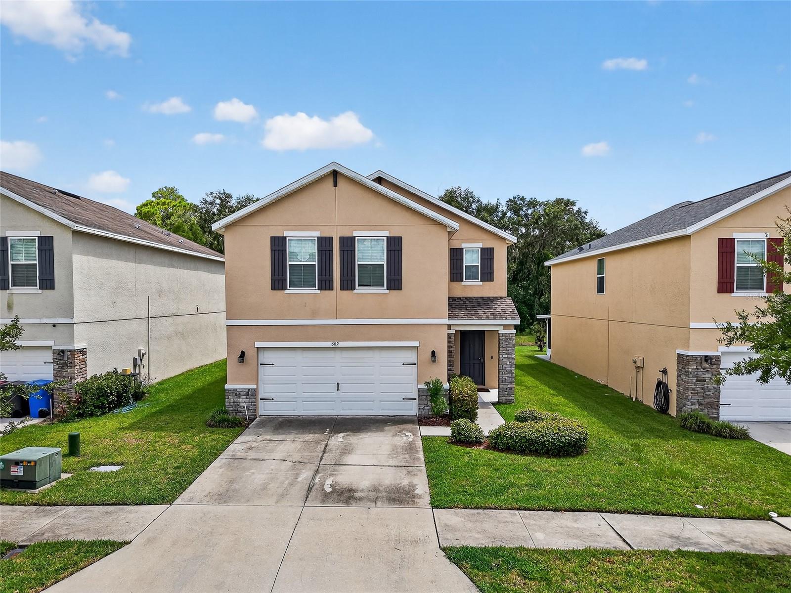 Welcome to this beautiful 4-bedroom, 2.5-bath home in the gated community of Walden Woods in Plant City. With no rear neighbors and a serene pond view, this two-story home offers both privacy and charm. A brand-new 2025 roof with a 20-year warranty ensures peace of mind for years to come. Step through the inviting foyer into an open-concept main level, perfect for gatherings and everyday living. The kitchen is a chef’s delight, featuring granite countertops, abundant espresso cabinetry, a large island with pendant lighting, a separate pantry, and stainless steel appliances, including a 2023 refrigerator and stove. The kitchen seamlessly flows into the dining and living areas, where wood-look vinyl flooring and natural light from sliding glass doors create a warm, welcoming atmosphere. A convenient half bath completes the downstairs layout. Upstairs, all bedrooms are thoughtfully situated along with a versatile bonus loft/family room and laundry for added convenience. The spacious primary suite boasts a walk-in closet and an en-suite bath with a double-sink vanity, step-in shower, private water closet, and linen storage. Three additional bedrooms, each with a ceiling fan, share a full bathroom with a double vanity. Enjoy Florida living year-round on the screened-in porch overlooking the large backyard and tranquil pond. Community amenities include a sparkling pool and basketball courts. The location can’t be beat, just outside a Publix shopping center, near a variety of dining options, and only 10 minutes to I-4 for easy travel to Tampa or Orlando. This home blends style, comfort, and convenience. Don’t miss your opportunity to make it yours!