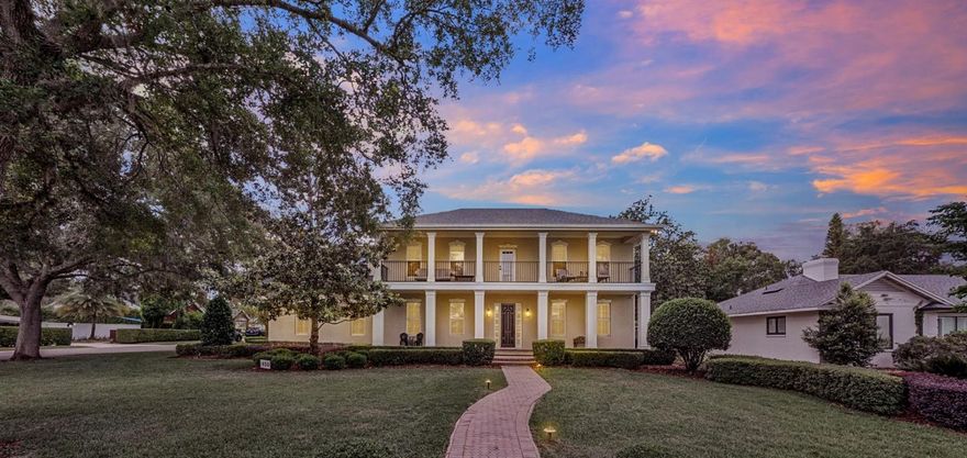 Sophisticated Lakeside Living in the Heart of Winter Park!  Experience the pinnacle of Florida luxury in this meticulously renovated estate, perfectly situated within walking distance of the world-class dining and boutiques of Park Avenue, views of Lake Osceola with easy lake access, with a coveted Winter Park location and top notch schools. 

This 5-bedroom, 4-full and 2-half-bath pool home residence offers an enviable blend of timeless architecture and modern refinement.
The interior has been updated and maintained to the highest standards. The home’s open-concept floor plan is anchored by rich, newer solid wood flooring and elegant plantation shutters throughout. At the heart of the home, the chef’s kitchen is a culinary masterpiece featuring, pristine quartz countertops, high-end stainless steel Bosch appliances, natural gas range, double ovens, and a walk-in pantry. A sophisticated entertainer’s bar area off the kitchen is equipped with a 100+ bottle dual-zone wine cooler, beverage cooler, ice maker, and service sink. This area is open to the kitchen an living areas for easy entertaining or catering.

The newly reimagined primary retreat is a spa-like sanctuary, showcasing white marble tile, a frameless glass shower with dual rainfall heads, a deep garden soaking tub, double vanity areas with new quartz counter tops, new mirrors and lighting and a bespoke walk-in closet. The primary walk in closet was just updated with a top of the line shelving and storage system for easy organization.  The home's floor plan is thoughtfully designed for flexibility, featuring a second primary suite on the main level. Back upstairs, you will find three additional guest bedrooms and two additional full bathrooms, a versatile bonus/flex room over the garage and a private balcony offering serene lake views.  The bonus room has endless possibilities and can be used as a recreation room, movie theatre, exercise room, play room, or in-law/nanny quarters as the second back staircase could be a private entry.

Outdoor Oasis & Infrastructure Designed for seamless indoor-outdoor living, the rear grounds feature a covered lanai over looking the pool.  The covered lanai offers a living and dining area, a newly built-in outdoor kitchen with a professional grill, and a paver-lined patio surrounding a sparkling pool and gas fire pit gazebo sitting area on the other side of pool area.  Plenty of yard space to throw the football, practice soccer skills or throw the frisbee with fido!!

Exceptional Features Include: Mechanical Integrity: Roof replaced in 2020; updated A/C systems (2016/2019); Rinnai tankless natural gas water heater, brand new primary bathroom, all bathrooms have been refreshed, recently updated kitchen, newer solid wood floors throughout.

Storage & Utility: 3-car garage with extended bays for extra storage, oversized closets throughout, and two convenient staircases.

Cozy Accents: 2 fireplaces with one being wood-burning and one gas. Three distinct breakfast/dining areas within the kitchen plus formal dining.

This is more than a home; it is an invitation to the quintessential Winter Park lifestyle you have been dreaming of living!