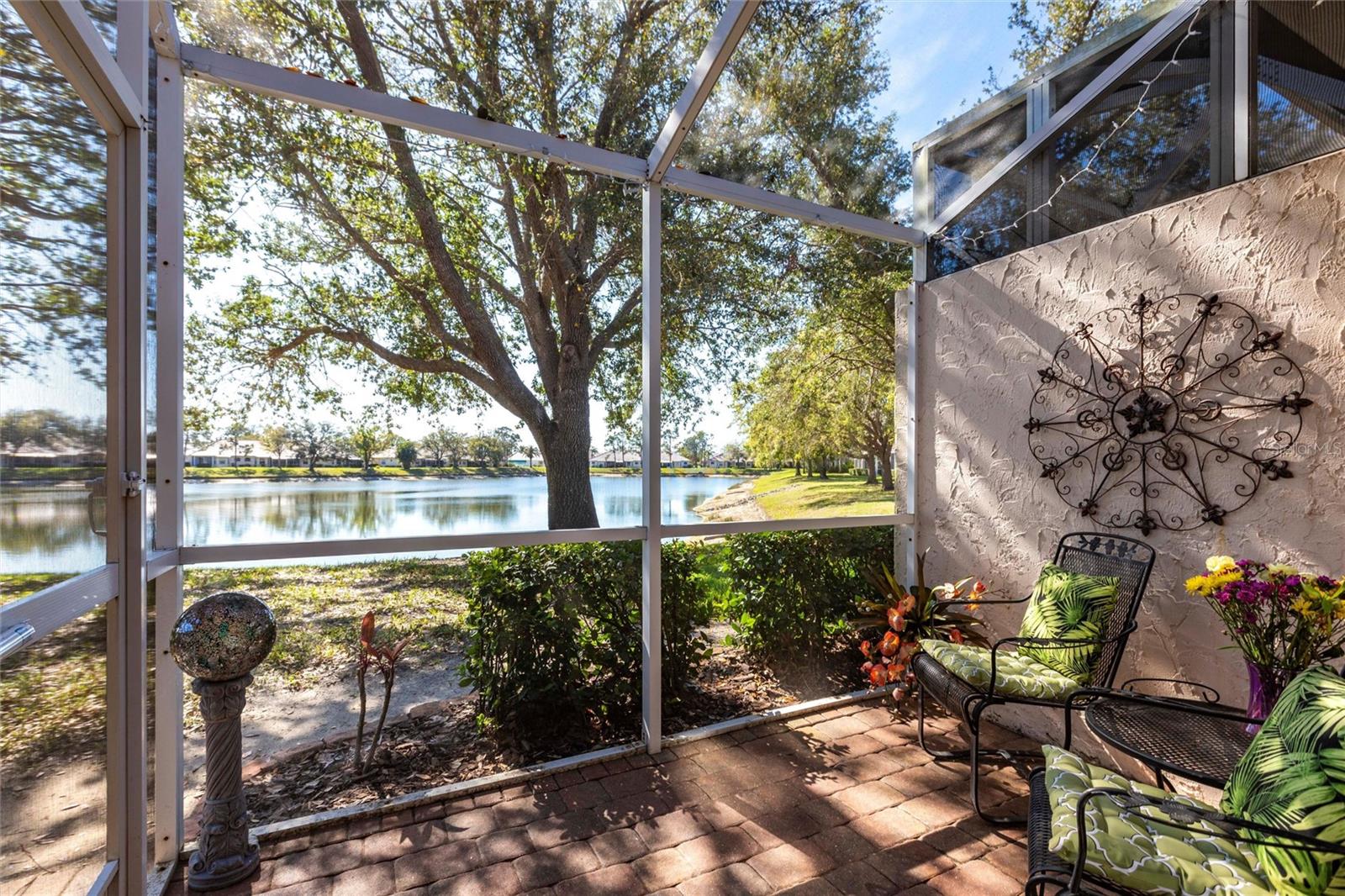 ***MILLION-DOLLAR WATER VIEW!***MOTIVATED SELLERS!***Say hello to what is without a doubt the best deal in the always popular Bobcat Villas in North Port! Featuring two bedrooms, a den off the entrance, and a flex room off the living room, this upgraded and move-in-ready villa offers plenty of privacy and space to spread out; and is guaranteed to impress. Recent updates include a brand-new tile roof in August 2024, fresh interior paint, and a newer refrigerator, dishwasher, and washer/dryer. Highlights include high-end granite countertops with undermount sinks in the kitchen and both bathrooms, custom moulding, six ceiling fans, french doors leading to the master suite that boasts a walk-in closet and roman shower, a covered and screened private lanai, tons of closet and storage space, and a two-car attached garage. Bobcat Villas is comprised of 110 villas and features its own clubhouse with kitchen and library, and a heated pool. It is located within the confines of Bobcat Trail, a gated community with its own clubhouse with full kitchen, library, fitness center, heated pool, and tennis/pickleball. Villa residents have access to all Bobcat Trail amenities and activities in addition to their own. This is a very active community where there's always something fun going on! With an acceptable offer, sellers are also willing to include a one-year home warranty through American Home Shield. Welcome home!