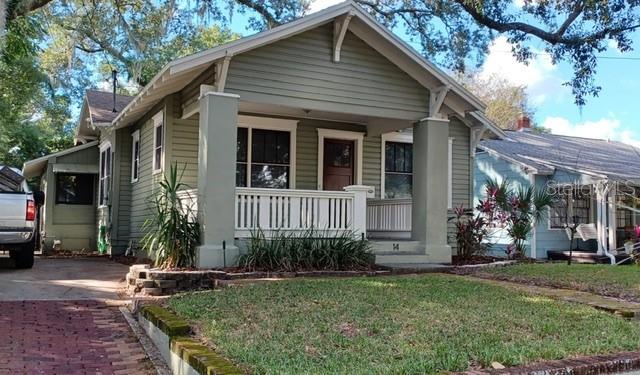 This Colonial Town bungalow offers all of the convenience of modern living along with the charm of a 1925, historical home! Heart of Pine floors throughout, tall ceilings, wide baseboards and window casings, gas fireplace with built-in shelving on either side. Bathrooms and kitchen have been updated. The kitchen includes a gas stove and opens out to the huge back deck, a superb layout for entertaining. French doors from the large master bedroom also open out to the back deck and private backyard. Tenants will enjoy the walk-in closet, and double sink vanity in the master bathroom. The long driveway provides for parking and the garage offers extra storage space. This property is centrally located, just around the corner from Thornton Park, The Milk District, Delaney Park, and Baldwin Park.