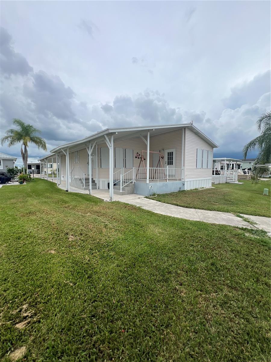 Welcome to Oasis Village- A 55+ Community. This beautifully maintained 2 Bedroom, 2 Bath home offers the perfect blend of comfort and convenience in the sought-after Oasis Village community. Overlooking the lake with a beautiful view of the fountain. Fully furnished- move in ready! Spacious master suite with walk-in closet. Large utility room for extra storage. Double carport for plenty of parking. Relax and enjoy the water with your own dock. Perfect for year-round living or a seasonal retreat, this home has everything you need to enjoy the Florida lifestyle. Community amenities include a Beautiful clubhouse for social gatherings, heated pool for year-round relaxation. Pickleball courts and billiards for active living. Covered mailboxes for added convenience. Located minutes from public boat ramps, close to shopping, and only 30 minutes from Brighton Bay Casino, you'll enjoy the best of both relaxation and recreation.