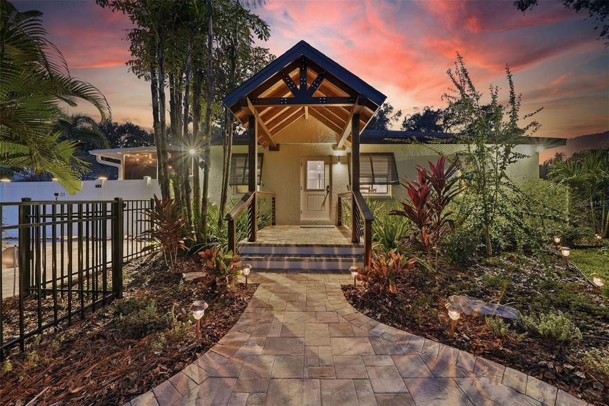 Welcome to your fully remodeled Saltwater Pool Home, on a beautifully landscaped corner lot sitting at the top of a hill on iconic Main Street with NO FLOOD ZONE and NO EVACUATION ZONE. Enjoy a generous .27-acre double lot—a rare find close to Downtown Safety Harbor, with plenty of privacy and room to live, grow, entertain, and breathe.

With over $500,000 in improvements, this smart home has been renovated from top to bottom—every system, surface, and space has been upgraded for peace of mind and refined living: New Heated Saltwater Pool with Fountain (2025), New Roof (2023), All New Impact Windows, Sliders & Doors (2024), New HVAC (2023), New Water Heater (2026), New Electrical Panel with Whole-Home Surge Protection (2024), Blair Water Softening System (2024), Modern Pavers (2025), Fresh Interior and Exterior Paint (2024), Attic Cleaning & Insulation (2023), Full RV Hookups (Water, Sewer, Electric in 2024). Fully Remodeled Kitchen, Wine Bar and Bathrooms (2024), New Irrigation System (2025), Refinished Hardwood and New Tile Floors. 

This 4-bedroom, 2-bathroom residence offers a thoughtful balance of classic character and contemporary design—nothing left untouched and nothing left to do but move in and enjoy.

Step inside and discover spaces designed to impress. Refinished original hardwood floors flow through the front living areas and kitchen, blending seamlessly with modern slate tile throughout the remainder of the home. The reimagined kitchen featuring soft-close cabinetry, stone countertops, modern fixtures, and a full suite of Whirlpool appliances (2024). Thoughtful touches abound—recessed LED lighting, updated doors, hardware, fans, and fixtures—curated for comfort and timeless daily living.

Privately positioned on its own wing, the primary suite feels like a personal retreat. Impact-rated sliders open directly to the heated saltwater pool, making indoor-outdoor living effortless. A thoughtfully expanded walk-in closet adds convenience and organization, and the suite's location ensures privacy rarely found in homes this size.

The living room and kitchen split the bedroom layout, creating privacy for everyone. The Primary Suite sits at the back of the home with Bedroom 2 nearby—ideal as an office, nursery, or guest room—while Bedrooms 3 and 4 sit off the dining room, perfect for family, visitors, or work-from-home needs.

Step outside and experience true Florida living. A new vinyl fence encloses the yards and pool area, where the saltwater pool and fountain shimmer beneath the sun, surrounded by fresh landscaping, modern pavers, and a screened porch for shaded comfort. Two outdoor showers, a utility sink, and a dedicated dog wash station make beach days, gardening, and pet care effortless. Perfect for hosting or unwinding, this outdoor space truly delivers. Centered on a 12,000+ sq ft double lot, each side serves a purpose: North offers a lush front yard and seating area; East provides a carport, a new shed, and parking for multiple vehicles, RV, boat, and golf cart with gated pool access; West features a shelled dog run and extra parking pad; South includes additional yard space and a fully finished detached ADU with it's own W/D, electric, water, and AC.

20 minutes to Tampa International Airport. 25 minutes to Clearwater Beach. Just 1 mile to Downtown Safety Harbor—cafés, restaurants, waterfront parks, festivals & the energy of a charming small town. Close enough to enjoy, yet far enough to escape the noise.