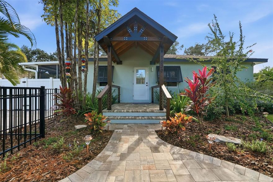 Welcome to your fully remodeled Saltwater Pool Home, on a beautifully landscaped corner lot sitting at the top of a hill on iconic Main Street with NO FLOOD ZONE and NO EVACUATION ZONE. Enjoy a generous .27-acre double lot—a rare find close to Downtown Safety Harbor, with plenty of privacy and room to live, grow, entertain, and breathe.

With over $500,000 in improvements, this smart home has been renovated from top to bottom—every system, surface, and space has been upgraded for peace of mind and refined living: New Heated Saltwater Pool with Fountain (2025), New Roof (2023), All New Impact Windows, Sliders & Doors (2024), New HVAC (2023), New Water Heater (2026), New Electrical Panel with Whole-Home Surge Protection (2024), Blair Water Softening System (2024), Modern Pavers (2025), Fresh Interior and Exterior Paint (2024), Attic Cleaning & Insulation (2023), Full RV Hookups (Water, Sewer, Electric in 2024). Fully Remodeled Kitchen, Wine Bar and Bathrooms (2024), New Irrigation System (2025), Refinished Hardwood and New Tile Floors. 

This 4-bedroom, 2-bathroom residence offers a thoughtful balance of classic character and contemporary design—nothing left untouched and nothing left to do but move in and enjoy.

Step inside and discover spaces designed to impress. Refinished original hardwood floors flow through the front living areas and kitchen, blending seamlessly with modern slate tile throughout the remainder of the home. The reimagined kitchen featuring soft-close cabinetry, stone countertops, modern fixtures, and a full suite of Whirlpool appliances (2024). Thoughtful touches abound—recessed LED lighting, updated doors, hardware, fans, and fixtures—curated for comfort and timeless daily living.

Privately positioned on its own wing, the primary suite feels like a personal retreat. Impact-rated sliders open directly to the heated saltwater pool, making indoor-outdoor living effortless. A thoughtfully expanded walk-in closet adds convenience and organization, and the suite's location ensures privacy rarely found in homes this size.

The living room and kitchen split the bedroom layout, creating privacy for everyone. The Primary Suite sits at the back of the home with Bedroom 2 nearby—ideal as an office, nursery, or guest room—while Bedrooms 3 and 4 sit off the dining room, perfect for family, visitors, or work-from-home needs.

Step outside and experience true Florida living. A new vinyl fence encloses the yards and pool area, where the saltwater pool and fountain shimmer beneath the sun, surrounded by fresh landscaping, modern pavers, and a screened porch for shaded comfort. Two outdoor showers, a utility sink, and a dedicated dog wash station make beach days, gardening, and pet care effortless. Perfect for hosting or unwinding, this outdoor space truly delivers. Centered on a 12,000+ sq ft double lot, each side serves a purpose: North offers a lush front yard and seating area; East provides a carport, a new shed, and parking for multiple vehicles, RV, boat, and golf cart with gated pool access; West features a shelled dog run and extra parking pad; South includes additional yard space and a fully finished detached ADU with it's own W/D, electric, water, and AC.

20 minutes to Tampa International Airport. 25 minutes to Clearwater Beach. Just 1 mile to Downtown Safety Harbor—cafés, restaurants, waterfront parks, festivals & the energy of a charming small town. Close enough to enjoy, yet far enough to escape the noise.