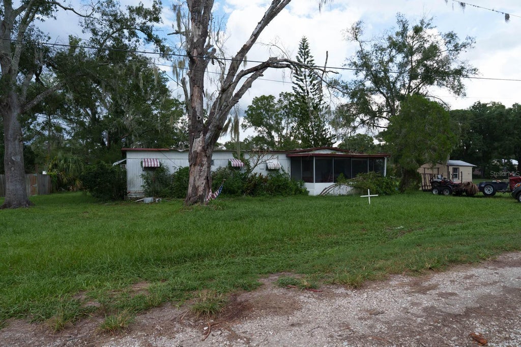 Photo of 1005 Grandaddy Lane, Lutz, FL 33548 (MLS # O6444562)