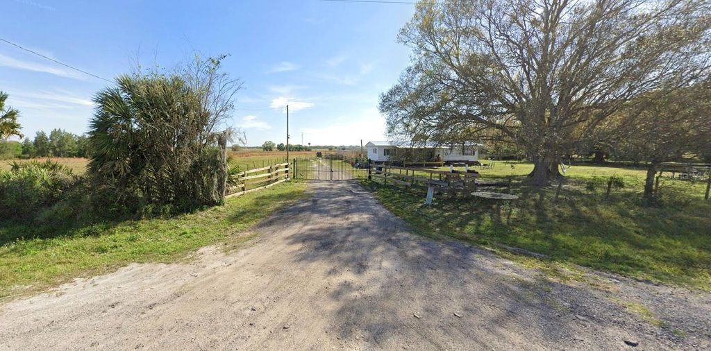 Photo of 702 NW 160th Street, Okeechobee, FL 34972 (MLS # C7518504)