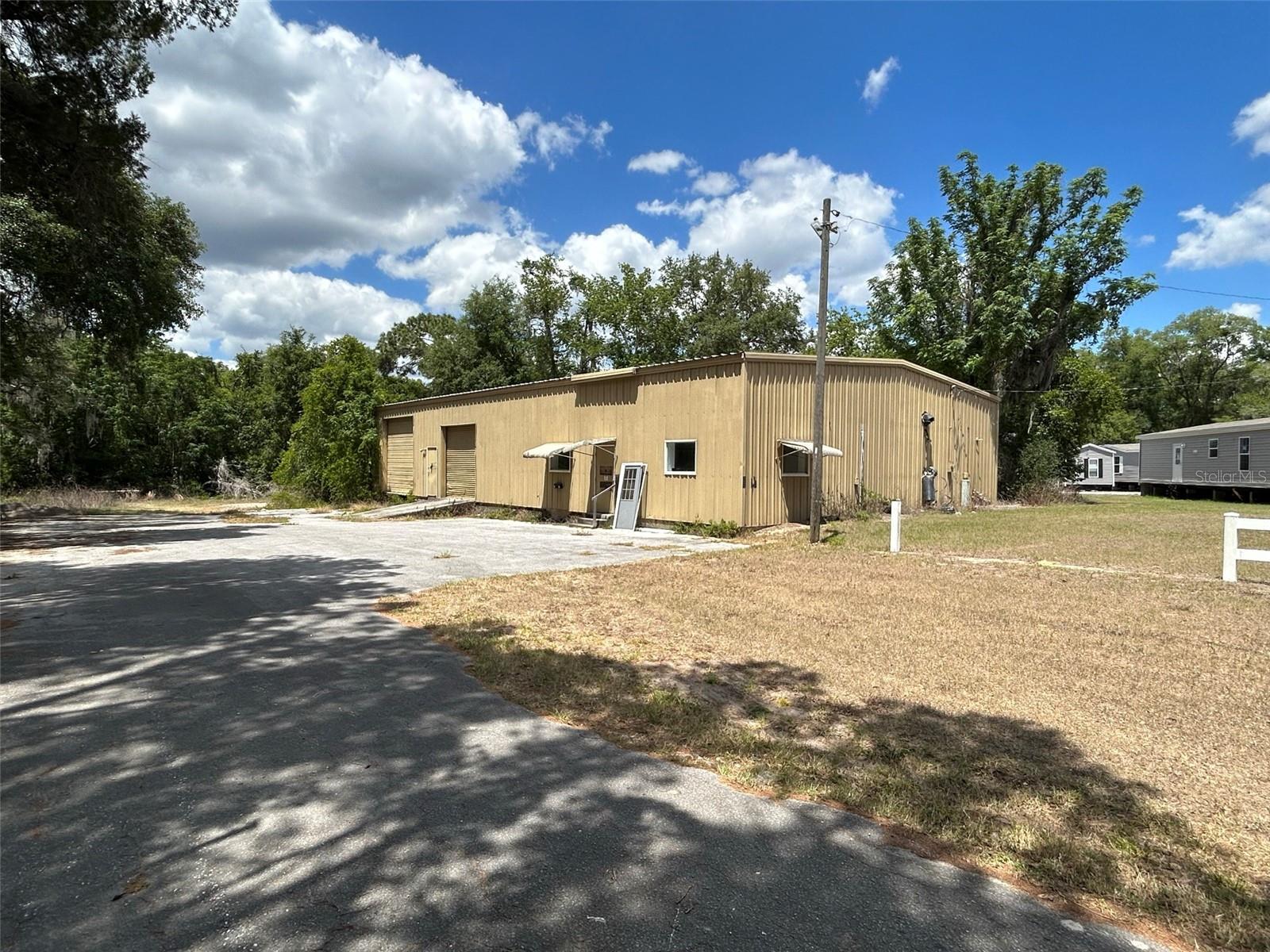 4,000 SF with frontage on Hwy 41 in Inverness! Great site for those needing easy access from Hwy 41 and other main roads. Property is zoned C in Citrus County. Office space is approx 600 SF and building has two bathrooms. Warehouse is estimated at 3,400 SF and is free span. 1 Dock height door and one above grade door (box van or ramp height). Tenants pays electric and water is on well and septic system. Property owner in the process of doing a clean out, in progress so building will be available for quick occupancy.