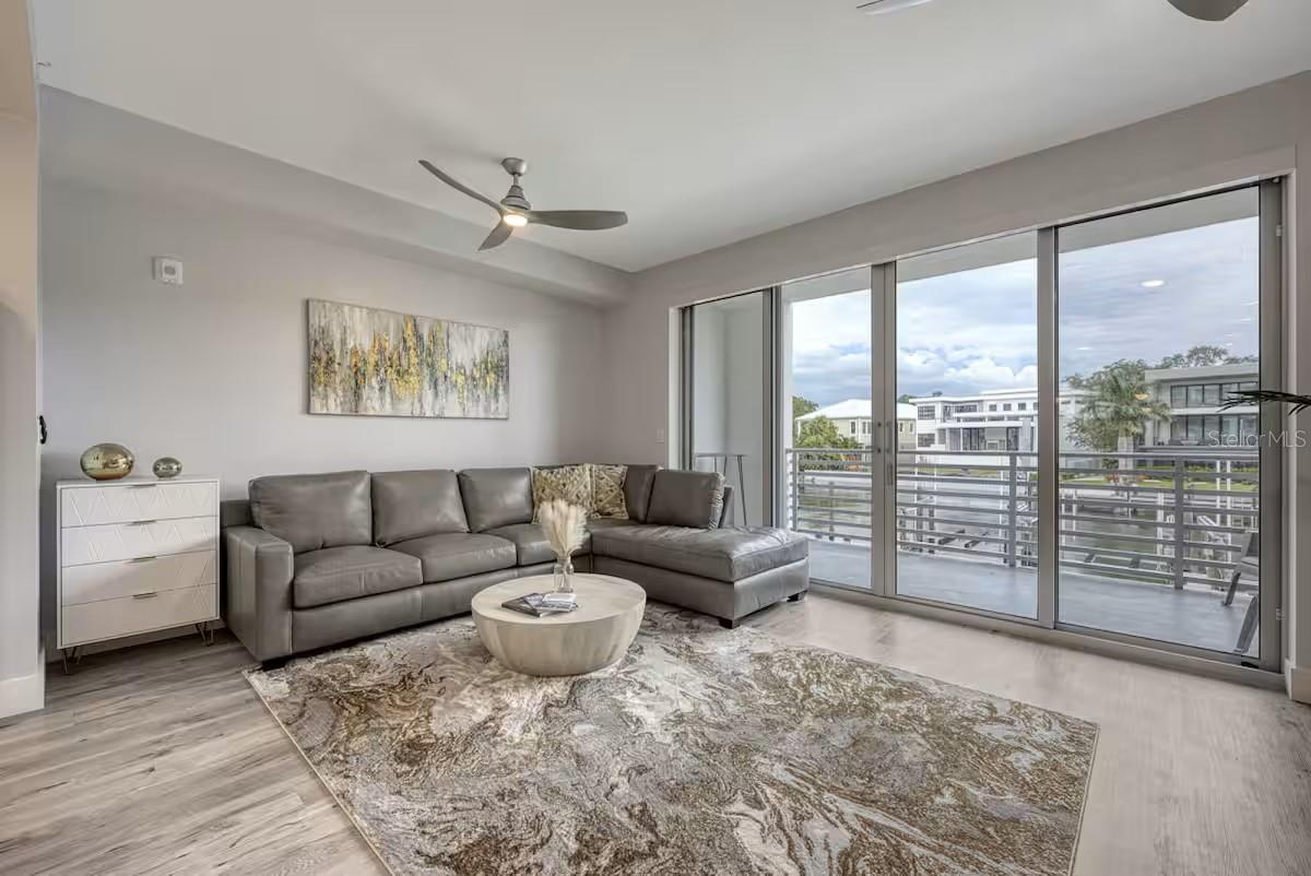 Discover the perfect blend of sophistication and relaxation in this one-bedroom plus den condo at The Strand, a premier waterfront community. Built in 2022, this turnkey furnished residence showcases over $20,000 in designer décor, offering an immediate sense of style and comfort. With breathtaking views of Sarasota Bay, this condo is ideal for full-time living, a vacation retreat, or a lucrative weekly rental investment.
Inside, the open layout boasts luxury vinyl flooring, quartz countertops, sleek modern cabinetry, and stainless-steel appliances. Beyond the condo, The Strand offers exceptional amenities, including a resort-style heated pool and spa, a fitness center, a dog park, and a floating kayak dock that leads to the Gulf of Mexico. EV charging stations, a fire pit, and gas grills add to the convenience.
Situated just a mile from downtown Sarasota, this property places you within easy reach of top-notch restaurants, cultural venues, and vibrant events like the Saturday farmers market. Nearby attractions include St. Armands Circle, Lido Beach, and the award-winning Siesta Key Beach. With an assigned parking spot, extra storage, and access to Sarasota’s best, this condo is your gateway to a luxurious waterfront lifestyle. Incredible property for a primary home, a vacation home or to be used as an investment. The unit can be rented 52 times per year min 7 days. Schedule your private tour today and experience The Strand!