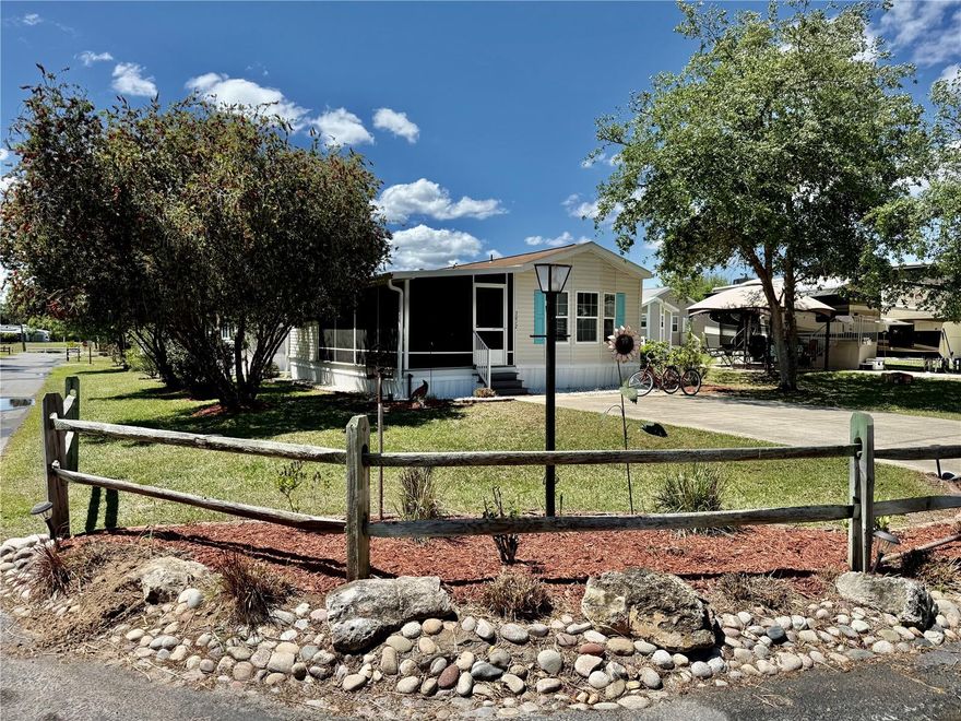 You made it—just bring your suitcase because this beautifully maintained Park Model comes fully furnished and ready to enjoy from day one. Spend endless days and relaxing evenings on the expansive 23x10 screened-in porch featuring durable Trex decking, the perfect place to unwind while overlooking two fully matured bottlebrush trees that have grown to an impressive, tree-like stature. Sip your favorite drink as hummingbirds gather, naturally drawn to the vibrant blooms, creating a peaceful and picturesque setting right outside your door. At the end of the porch, you’ll find a spacious 13x10 storage/workshop, ideal for hobbies, tools, or extra storage. The Wilderness RV Resort is a unicorn as you actually own the land. It will come with a warranty deed. There is no lot rent just an HOA fee that covers water, trash, sewer, they cut the grass and blow off the driveway. All this and the ample amenities that the park keeps immaculate. Wilderness RV Resort offers exceptional amenities including a massive community pool, a well-equipped fitness center with sauna and steam room, recreation hall, laundry facilities, convenient mailbox area, and an impressive dog park for four-legged residents. Just outside the park you’ll find a diner and a charming gift shop known for its famous whoopie pies. Enjoy direct access to fishing and kayaking, whether paddling upstream or downstream to iconic Silver Springs State Park, where you can experience crystal-clear waters and unforgettable wildlife sightings including manatees, alligators, and yes—even monkeys. When you’re ready to explore beyond the resort, historic downtown Ocala’s vibrant Square is just a short drive away, offering an exciting mix of restaurants, billiards, live music on weekends, a comedy club, and local favorites like Brick City BBQ, along with the retro Marion County movie theater featuring a full liquor bar. This is more than an RV lot—it’s a lifestyle filled with relaxation, recreation, and true Florida charm.