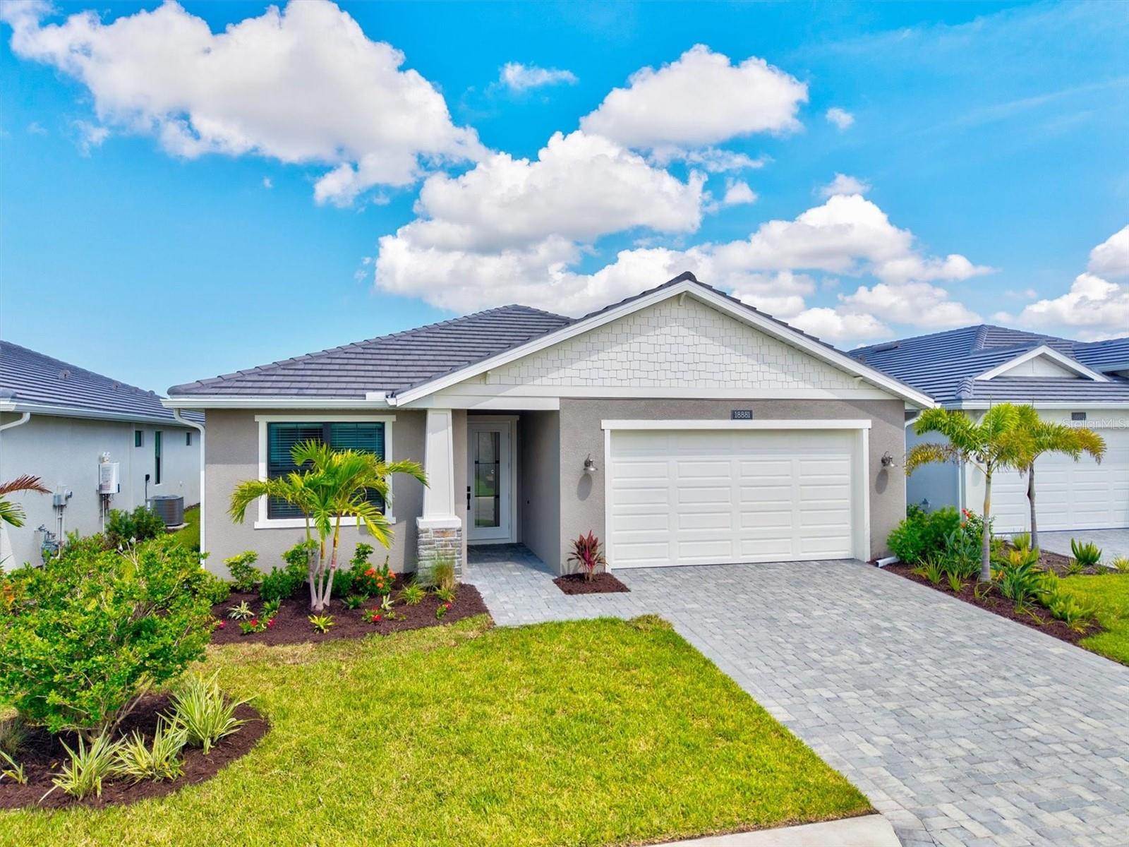 TURNKEY FURNISHED and masterfully elevated, this 2024-built residence in Solstice at Wellen Park spans over 2,000 square feet of seamless living, where design and function move as one. With more than $147,000 in curated upgrades, this home delivers beauty with purpose in every detail.
Anchored by full hurricane-impact windows and doors, the exterior is wrapped in custom landscaping, a paver driveway, and subtle architectural lines that lead to a space defined by warmth and flow. Inside, coffered ceilings, smart home controls, and custom window treatments create an atmosphere of quiet sophistication.
The kitchen is a refined statement—European-style soft-close cabinetry, granite island with gold hardware, black tile backsplash, and premium KitchenAid appliances, including a five-burner gas cooktop, wall oven, microwave, and range hood. A walk-in pantry adds function behind the design.
Light shifts effortlessly through the open living and dining area, enhanced by upgraded lighting, premium flooring, and an intuitive layout that balances elegance with ease. A spa-inspired primary suite offers dual vanities, a frameless glass shower, Kohler fixtures, and a generous walk-in closet—all designed to restore and renew.
Beyond the glass, the screened lanai invites alfresco indulgence, thoughtfully prepped for a bespoke outdoor kitchen experience and surrounded by lush, irrigated landscaping and ambient lighting.
Furnishings are designer-curated and included: a 100” Hisense 4K QLED TV, Sonos Arc soundbar, Tempur-Pedic motorized beds, walnut cabinetry, cloud-soft sectional, glass dining set, and a complete office suite—turnkey in the truest sense.
The epoxy-coated garage floor mirrors the same level of care and finish found throughout the home. Every fixture, surface, and system—from the integrated pest control to the programmable thermostat—was chosen to elevate daily life.
Located in an X flood zone with no flood insurance required, and part of a gated, maintenance-free community offering resort-style amenities: clubhouse, fitness center, heated pool, pickleball and tennis courts, dog park, yoga lawn, playground, and scenic walking paths. HOA includes cable, internet, irrigation, lawn care, pest control, and full community upkeep. CDD fee is built into property taxes.
All just minutes from Downtown Wellen Park, CoolToday Park, and a short coastal drive to Venice Island and the Gulf’s most serene beaches. Full upgrade and furnishings list available in MLS attachments.
