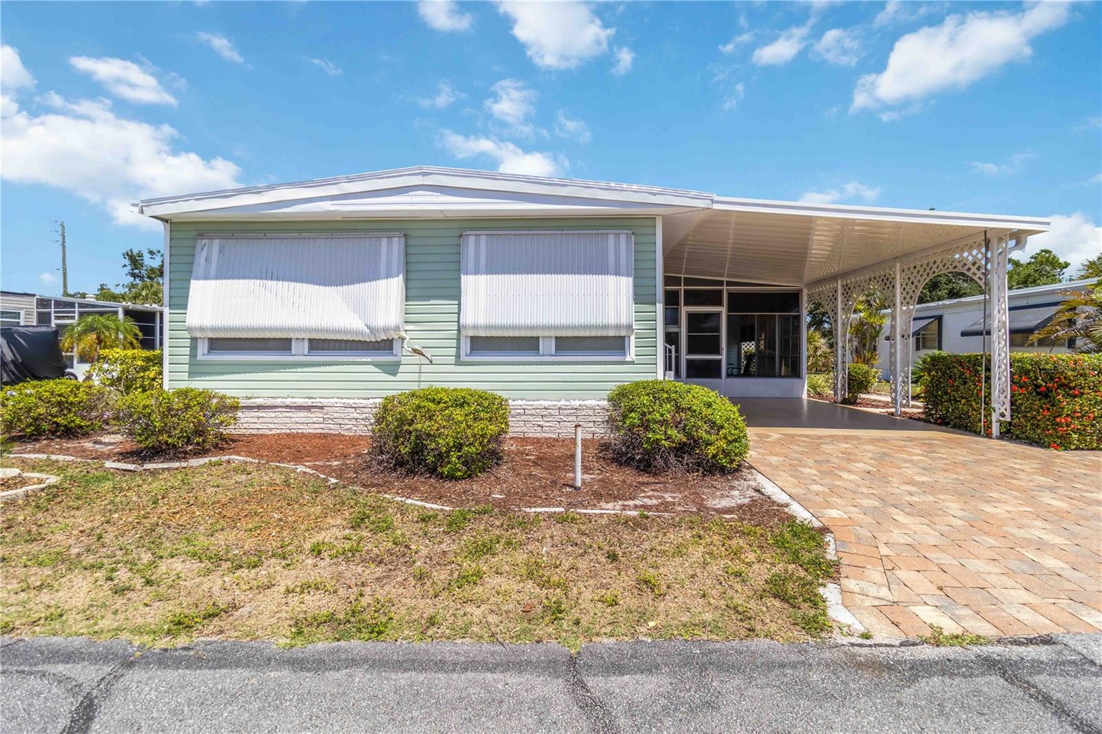 Welcome to Your Slice of Paradise in Venice Isle!
Discover the perfect Florida lifestyle in this beautifully maintained 2-bedroom, 2-bathroom home located in Venice Isle, the premier resident-owned 55+ mobile home community in Venice. This charming residence offers comfort, thoughtful updates, and a warm community atmosphere just minutes from the Gulf beaches and historic downtown Venice.
Inside, you’ll love the updated kitchen featuring white cabinetry, a center island with pendant lighting, and an open layout that seamlessly connects to the main living area. The primary bedroom is spacious and inviting, offering two closets, a ceiling fan, wall-to-wall carpet, and a private ensuite bathroom. The second bedroom also includes a built-in closet, ceiling fan, and plush carpeting. A well-appointed second bathroom features a large vanity and a tub/shower combination. There's also a large storage area with a full-size washer and dryer for added convenience.
Enjoy the outdoors year-round with a covered outdoor seating area complete with a ceiling fan. A BRAND NEW ROOF & 1-CAR CARPORT round out the home’s valuable features.
Venice Isle offers an active and engaging lifestyle with two clubhouses, two heated pools, two hot tubs, fitness facilities, saunas, putting greens, shuffleboard and Bocce ball courts, tennis courts, a miniature golf course, art and ceramic studios, a library, card rooms, TV lounges, billiards, horseshoes, and even Sunday services—all designed to enrich your day-to-day living.
This move-in ready home provides the ideal opportunity to enjoy the best of Florida living in a welcoming, amenity-rich community. Schedule your private tour today!