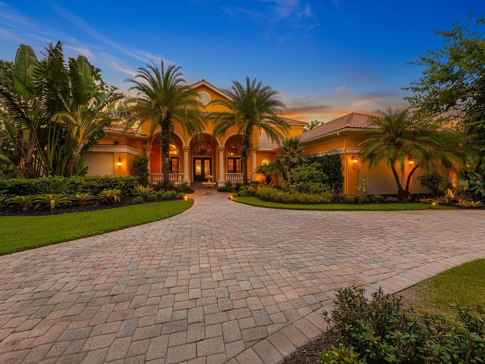 An incredible residence by John Cannon Homes situated on one of the rare, elongated lots in The Concession that offers stunning water views and picturesque preserve vistas. Your journey begins with the striking fountain entry and Cantara iron doors. We welcome you into a beautifully crafted interior. This space showcases high-end finishes, including intricate ceilings, crown moldings, designer lighting, French doors, hardwood floors, custom tiles, marble, and stone. This home is a true embodiment of elegance, with furniture-quality cabinetry, two distinct fireplaces, handcrafted built-ins and woodworking, ornate architectural details, Sonos Sound System, superb Windsor Pinnacle windows, and doors that artfully elevate its aesthetic appeal. It boasts impressive square footage and sophisticated formal dining and living spaces with ceiling-to-floor windows that overlook the pool and a lake view beyond. This residence has four bedrooms and five baths, along with an executive office and a spacious family room combined with a breakfast nook. Additionally, there is a welcoming bonus media room on the second floor, complete with a wet bar and an enclosed balcony, creating the perfect space for relaxation and entertainment. A gourmet kitchen is a true haven for culinary enthusiasts. This exceptional space features premium appliances: a professional-grade Wolf oven and gas range, a Sub-Zero refrigerator with a glass door, and a high-performance Bosch dishwasher. Between the kitchen and formal dining room, you'll find a Butler's Pantry, fully equipped to make entertaining a true delight. The impressive Owner’s Retreat has access to outdoor spaces, enhancing the connection with nature. This suite also has two handsomely designed walk-in closets and a luxurious primary bath. At its center, an exquisite garden tub stands out, complemented by a stunning three-piece shower that includes a rainfall showerhead and an aquarium glass panel overlooking the atrium. Imagine lounging by the heated pool or unwinding in the spa outdoors, all while enjoying breathtaking views of a sprawling lake. An outdoor kitchen area is nothing short of spectacular, perfect for entertaining. Nestled within a secure, gated community, The Concession spans over 1,200 acres. It features a privileged number of private homesites that highlight the charm of historic Florida, creating a perfect blend of tranquility and safety. The Concession Golf Club is a premier destination with courses designed by Jack Nicklaus in partnership with Tony Jacklin, including an 18-hole championship course, a 9-hole par-three course, and a lighted putting course. The club also boasts impressive practice facilities, featuring a driving range, as well as large putting and chipping greens. Additional amenities comprise a pro shop, guest lodging, The Bistro with a diverse dining experience offering 365 wines, and monthly social events, alongside a Saturday morning market. There are both Social and Golf Membership options. For details on availability, please contact the Membership Director. Residents can also enjoy the vibrant shops, delightful restaurants, and entertainment at UTC, Benderson Park, Lakewood Ranch Main Street, and Waterside with just a quick drive. Additionally, they have access to enriching cultural activities and the white-sand beaches of Sarasota. This area offers the perfect balance of peaceful living with convenient access to everything you love without the burden of CDD fees!
