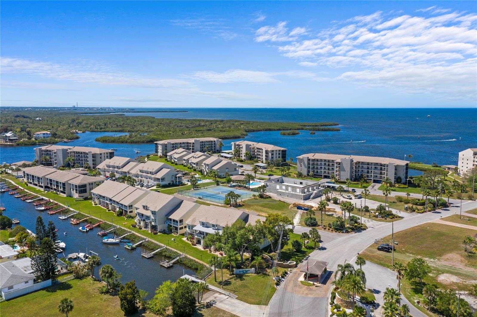 This waterfront condo is located in the much desired SAND PEBBLE gated community. The community is well maintained and has so much to offer. 24 hour gate guard, waterfront boardwalk, new clubhouse with fitness, library, game tables, card room, tennis, pickleball and multiple pools with cabanas and gas grills. This condo offers gorgeous views of the Pithlacascotee River from almost every window with partial Gulf view as well. Updated kitchen, great room with waterfront view and sliding door access to the enclosed lanai, updated baths, large guest bedroom, master bedroom with access to the enclosed lanai, vanity, walk in closet and en suite bath with walk in shower.
AC new in 2021, Washer and Dryer new in 2022. Sliding doors are storm rated. One under building parking space reserved and storage locker. SAND PEBBLE is close to waterfront dining, historic downtown restaurants, theatre, night life, Sims Park (festivals and activities), approx 20 min to Tarpon Springs Sponge Docks and Fred Howard Park, approx 40 min to Caladesi Island and Honeymoon Island, approx 60 min to famous Clearwater Beach, approx 60 min to Tampa airport, Tampa Cruise port, Sports Arenas, Theatre, Theme Parks, Nightlife and Shopping! NO PETS. NO SMOKING. NOT AGE RESTRICTED. Dues $990.80 (This breaks down to: $468.40 toward insurance and $522.40 for maintenance of amenities and community). Includes: trash, cable, internet, use of grounds and amenities, flood and hazard insurance on the building, escrows, security, management.
Call to schedule your private showing. This one will not last long.