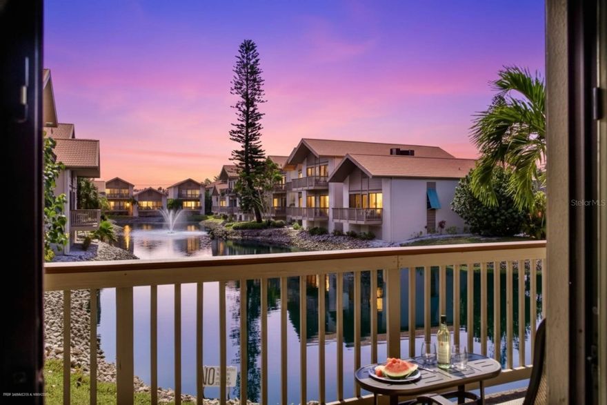 See this Fabulous Beach Retreat w/Rental Income Opportunity Located Directly Across the Street from the #1 Ranked Beach in the USA! This incredible 2020 Fully Remodeled and Newly Furnished Condo is Steps Away from the Famous Siesta Key White Crystal Sandy Beaches and Turquoise Gulf Waters! UNIT FEATURES: 2 Large Bedrooms, 2 Fully Remodeled Baths, Great Split Level Floor Plan, Main Level includes the Living Room and Master Suite both with Long Lake Views and Balconies to Enjoy the Gulf Breezes and Beautiful Sunsets, Living Room and Master Suite have Vaulted Ceilings, Master Suite has a Fabulous Updated Master Bath w/Dual Shaker-Style Cabinets and Granite Counters, Walk-in Shower w/Beach Pebble Shower Floor, Spacious Dressing Area w/Built-in Closets; Upper Level includes Large Dining Room Overlooking the Living Room to the Lake Views, Elegantly Remodeled 2020 Light Bright Kitchen w/White Shaker-Style Cabinetry, Granite Counter Tops, Stainless Steel Appliances, Eat-in Kitchen Area, Pantry Closet, Laundry Closet plus a Slider to Balcony w/Sunset Views of the Tennis Courts; Split Plan Guest Bedroom Suite also includes a Balcony w/Views of the Tennis Courts, Remodeled Guest Bath w/Designer Tile, Granite Counter Tops and Combo Tub/Shower, 10' Ceilings, Brand New 2025 Tile Flooring on Main Level, One Car Garage on Ground Street Level w/Tons of Storage for Beach Chairs, TURNKEY FURNISHED w/Brand New Coastal Furniture, Home Sleeps 6 w/Sleeper Sofa, Paid in Full $60,000 for Brand New Impact Sliders, Impact Windows and Impact Garage Door to be installed in Spring of 2026, One Small Dog is Permitted for Owners. CONDO includes: Resort Style Amenities, Heated Pool, Tennis and Pickle Ball Courts and BBQ Pavilion. RENTAL FACTS: On-Site Rental Management Office Conveniently Available to take Advantage of the (52) Weekly Rental Program or Choose Your Own Airbnb Program. Owner Currently Books Rentals via Full Service Management through iTrip. Unit Income is approx $60,000 per year. COMMUNITY includes: Public Beach Access Across the Street w/Sand Volley Ball, Tennis & Pickle Ball Courts and Drum Circle. Siesta Key Trolly Transportation to Siesta Key Village is nearby to plenty of Restaurants, Bars, Ice Cream Shops and Boutiques. No Flood Damage to Unit.