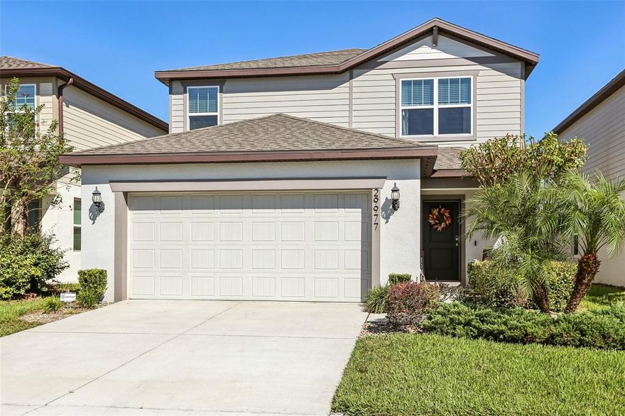 LUXURIOUS 2021 Pulte Homes built McNair Floorplan Home featuring 2,207 sf in the Highly-Desired community of Wesbridge in Wesley Chapel. Home features 4 BEDROOMS, 3-Full BATHROOMS, 2-CAR GARAGE, and an OUTOOR PARADISE with a Large PAVER PATIO and GAZEBO in a FULLY FENCED BACKYARD to truly enjoy the Florida lifestyle! Original Owners have also added Wood Look Flooring in several rooms Including the large Great Room. Step through the welcoming entry into the spacious foyer leading to the OPEN-CONCEPT Great Room, Kitchen and a Guest Bedroom/Office with Full Guest Bathroom. The Centerpiece of the home is a chef's dream GOURMET KITCHEN with luxurious quartz countertops, Contemporary Tiled Backsplash, Stainless Steel appliances, LARGE ISLAND with Breakfast Bar, Range and microwave featuring an Exhaust that vents to the outside, Large Pantry and Plentiful Kitchen Cabinets. The large Great Room has extra ceiling can lights and Wood Look Flooring. The second floor features two additional bedrooms that share a full hall bathroom, laundry room, and a wonderful loft for relaxing in addition to the PRIMARY SUITE that offers great appeal with a luxurious EN-SUITE BATHROOM with dual sink vanity with upgraded fixtures, walk-in shower and Large WALK-IN closet! Hurry and start enjoying the sunny Florida lifestyle with this home that offers Easy access to I75 for convenient access to all that Tampa Bay has to offer!  WELCOME HOME!