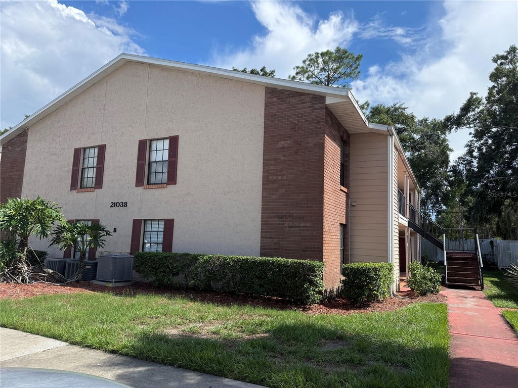 Photo of 21038 Voyager Boulevard #4, Land O Lakes, FL 34638 (MLS # TB8545029)