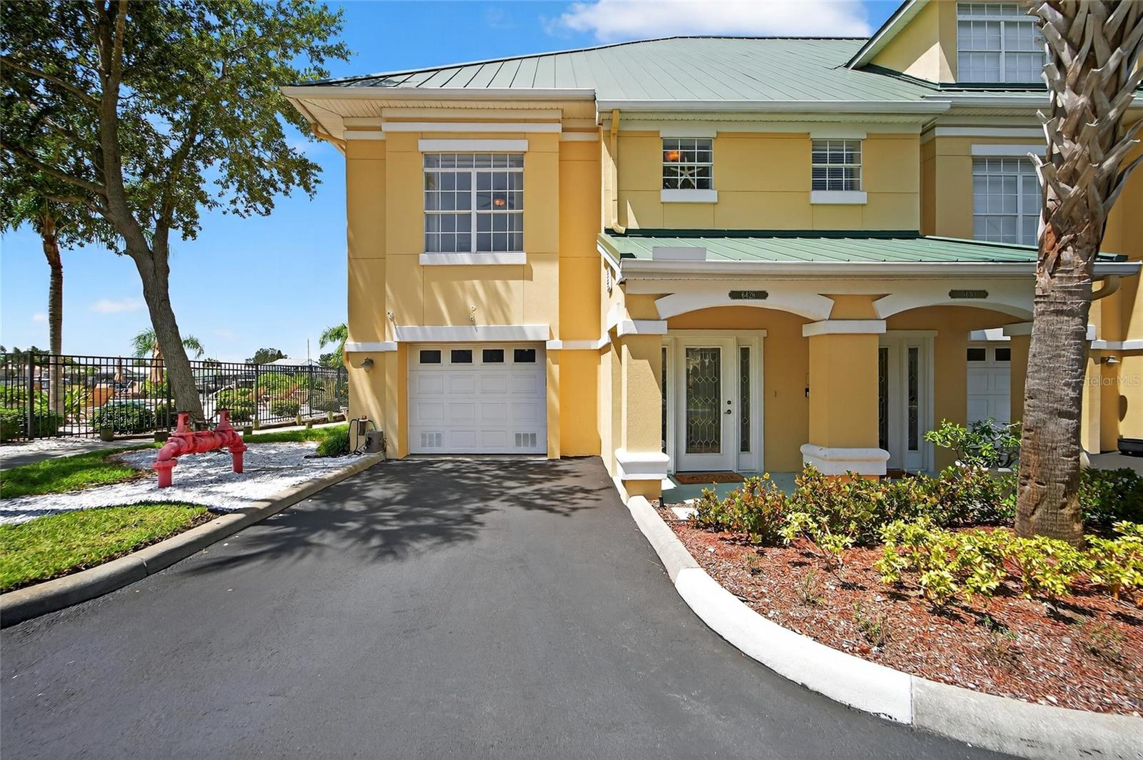 6428 Sunset Bay Cir, Apollo Beach, FL 33572 | 3 Beds | 2.5 Baths | 2,350 Sq Ft | End-Unit Townhome with Water Views | 3-Car Tandem Garage
This spacious canal-front townhome in the gated community of Sunset Bay offers 3 bedrooms, 2.5 bathrooms, and 2,350 square feet across three levels—with a rare 3-car tandem garage. Enjoy peaceful views of the saltwater canal and pond from your screened patio or upper-level balcony. Inside, you'll find bamboo flooring, crown molding, solid surface countertops, and a private elevator for easy access between floors. The second level includes the main living space, dining area, kitchen, laundry room, and a large primary suite with walk-in closet. The top floor features two oversized guest rooms with walk-in or built-in closets. Sunset Bay residents enjoy amenities like a heated community pool, dog park, fishing pier, and shared dock with canal access to Tampa Bay. HOA covers exterior maintenance, pest control, water, and more. Located just minutes from marinas, dining, and waterfront recreation.
