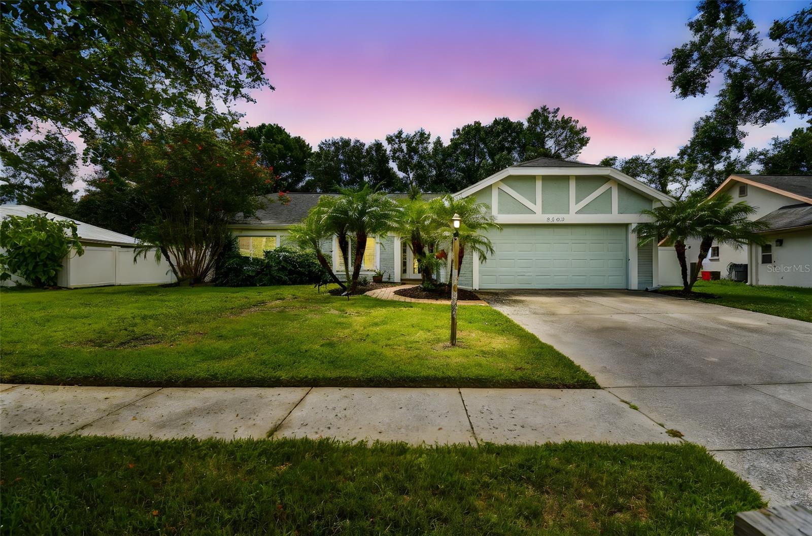 Located in the lovely community of Pebble Creek Village in New Tampa, this charming single story home offers 3 bedrooms, 2 bathrooms and generous living spaces throughout. The extra large living room is perfect for relaxing or entertaining and is conveniently connected to a stylish wet bar-ideal for hosting or enjoying an evening cocktail. A bright dining area with sliding glass doors leads to the over-sized screened lanai, featuring a built in sink and minifridge for outdoor entertaining. The expansive kitchen is equipped with a breakfast bar, newer appliances, window to the porch and open views into the separate family room, making it the true heart of the home. The spacious owner's suite is a private retreat, boasting an ensuite bath and walk in closet. Two additional bedrooms are separate with their own full bathroom, providing comfort and privacy for family or guests. Set on a fenced 86 x 112 lot, the back of the property provides mature trees for ambiance and privacy. Take advantage of the ample greenspace for outdoor living or family sports. The indoor laundry room includes washer, dryer, large sink basin and cabinets galore for all your storage needs. Enjoy all the conveniences of Pebble Creek living-just minutes to schools, shopping, restaurants and major interstates for easy commutes.
***Tour our listing online via the Virtual Walk Thru: https://my.matterport.com/show/?m=CfQBoU336uQ&brand=0&mls=1&