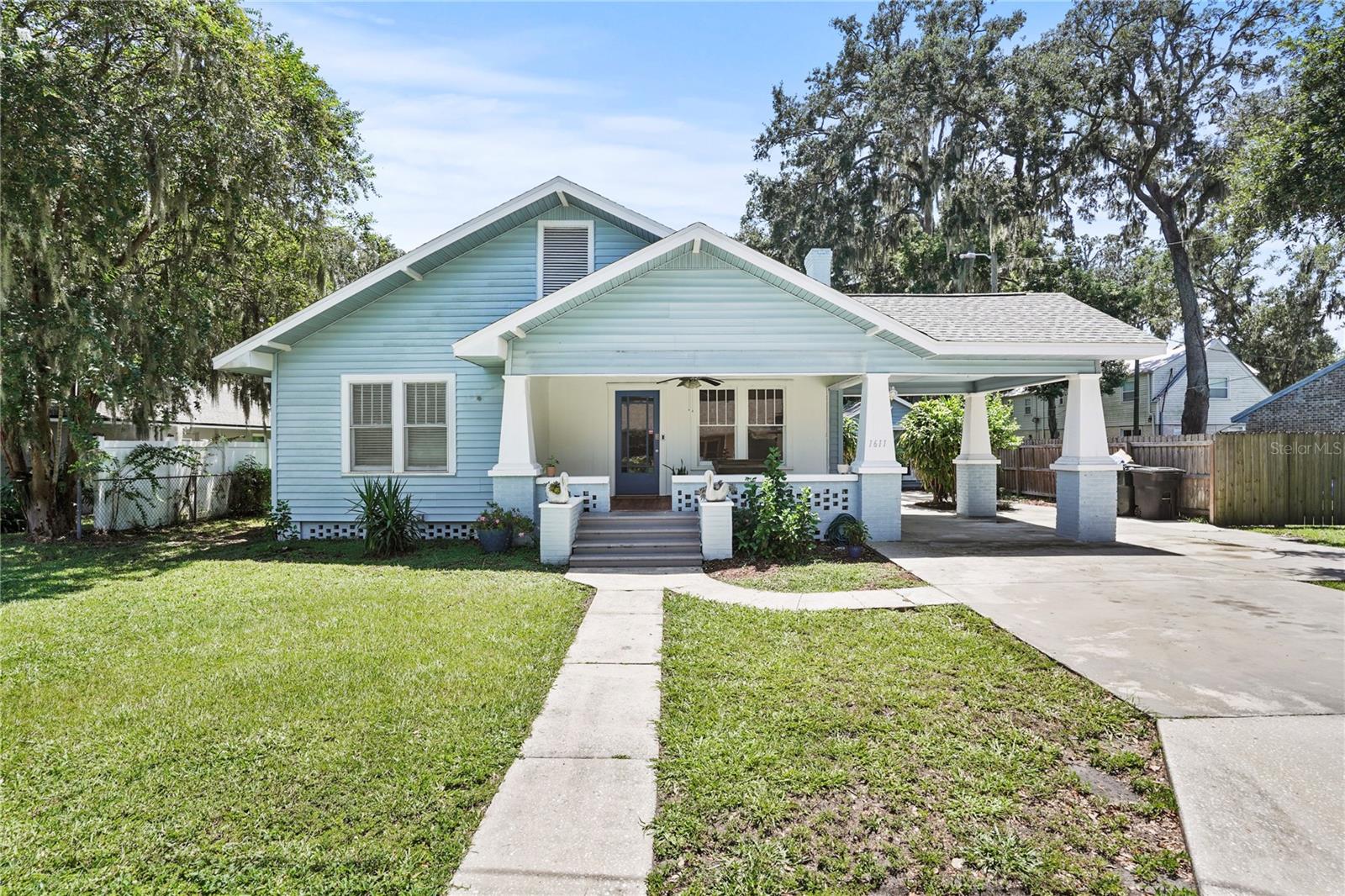 This centrally located historic pool home on a dead end cul-de-sac blends classic charm with modern upgrades just moments from Lake Hollingsworth and Downtown Lakeland. The main home offers refinished hardwood flooring throughout, three bedrooms and two bathrooms in main part of home 1791 sq ft with the second bath currently under renovation, and a newly updated kitchen featuring quartz countertops, custom cabinetry, tile backsplash, designer lighting, and upgraded hardware that flows seamlessly with the home’s original style. A cozy wood-burning fireplace with a new damper adds to the character. Best of all, there is a soundproofed detached mother in law suite (no kitchen) 250 sq ft that was once used as a recording studio. This offers the perfect setup for a private home office or a comfortable space for visiting family and friends. Recent improvements include a tankless water heater, new tile in the laundry room, new roof and updated electrical in 2023, new appliances, reverse osmosis system, fresh interior and exterior paint, newly stained porch, stackable washer and dryer, saltwater pool conversion, and new pool filter and vacuum. The detached suite was renovated in 2023 with updated flooring and a refreshed bathroom completed in 2024. The third-acre lot is fully fenced and features a screened saltwater pool and charming front porch for peaceful mornings and a one carport. Located near parks, Florida Southern College, shopping, dining, and outdoor recreation, this home combines historic character with functional living and an unbeatable location.