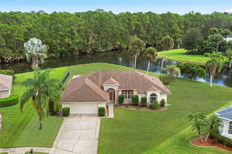Welcome to Riverwood Plantation, one of Port Orange’s most desirable communities. This 3-bedroom, 2-bathroom home with a 2-car garage offers the perfect balance of space, comfort, and convenience—all with peaceful water views as your backdrop. Inside, soaring volume ceilings and large windows fill the living spaces with natural light. The eat-in kitchen provides a cozy spot for morning coffee, while the open layout makes entertaining a breeze. The primary suite is a true retreat, featuring a soaking tub, separate walk-in shower, dual sinks, and a deep walk-in closet. Two additional bedrooms are generously sized, each with built-in closets, and the guest bath offers a shower/tub combo for flexibility. An enclosed Florida room with serene water views is ideal for unwinding with a glass of wine in the evening or curling up with a good book. Step outside to find a large fenced-in yard—perfect for pets, backyard gatherings, or even adding a private pool to complete your dream retreat. Riverwood Plantation is more than a neighborhood—it’s a lifestyle. Residents enjoy private access to Spruce Creek with a community dock and boat launch, plus amenities including a clubhouse, pool, tennis and pickleball courts, racquetball, playground, and dedicated RV/boat storage. Whether you’re searching for a full-time residence or a seasonal escape, this property is move-in ready and waiting for your personal touch. Schedule your private showing today and experience all that Riverwood Plantation has to offer!