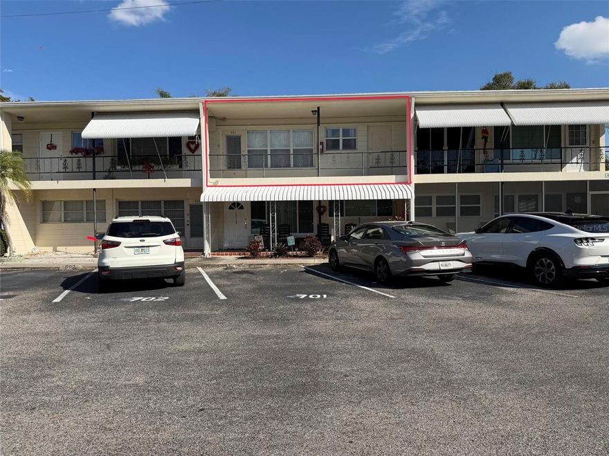 Wow!  Take a look at the lowest priced 2 bedroom 2 bathroom condo in Clearview Oaks! Come and sit in the Florida room and listen to the fountain while you gaze at the pond. This well maintained 2/2 has had the same owner since 1993!  The A/C and Water heater are both recently replaced in 2023.  Enter through the front door to your living room and dining room combo and continue on to the open kitchen with the built-in oven and sliding doors leading to the Florida room.  From the spacious Florida room is a nice view of the pond accompanied by the relaxing sound of the pond fountain.  You also have the convenience of inside laundry right there with the stackable washer and dryer unit included!  The primary bedroom is complete with a full primary bathroom and a large built in closet.  Down the hall is the full guest bathroom, a large storage closet and the 2nd bedroom.  The low monthly condo fee covers water, sewer trash, the roof and more!  Enjoy your own assigned storage space and park in your own assigned parking space close to second level access.  Come quick to take advantage of this incredible opportunity and make this inviting space your masterpiece!  Don’t miss your chance to own in the desirable owner-occupied 55+ community of Clearview Oaks!