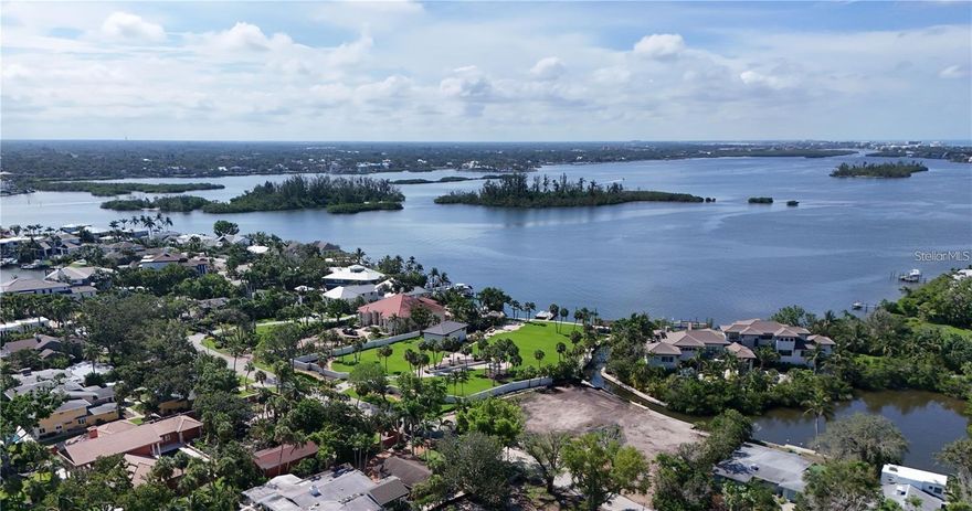 Pre-Construction. To be built. Boating access and large lot opportunity. This rare 11,884 sq.ft. lot on Siesta Key offers a unique opportunity to build your dream home in one of the most sought-after areas. Fit up to a 42-foot boat on the private dock, and boat off the canal into Roberts Bay. There is 100 ft of waterfront to enjoy. This property is a short drive past the north bridge, in a mature and developed luxe neighborhood on Bay Island.

With the world-renowned Siesta Key Beach easily accessible and the convenience of the North Bridge within only a few minutes, this location offers both privacy and quick access to Southside Village, Downtown Sarasota, and all the attractions the area has to enjoy.

The lot has already been cleared and prepped for development, making it primed for your vision. Initial investments have been made, including storm debris clearing, house demolition, tree mitigation, and securing all the necessary permits.

The current developer is available to present existing plans for an elevated single-story residence or a two-story residence, should you prefer to modify the design. This is a truly rare opportunity to create a custom home in an unbeatable location!

 This is the price of the land only.  The rendering of home is available with full plan set ready to go for us to build or for and your own builder.  Please call for details.