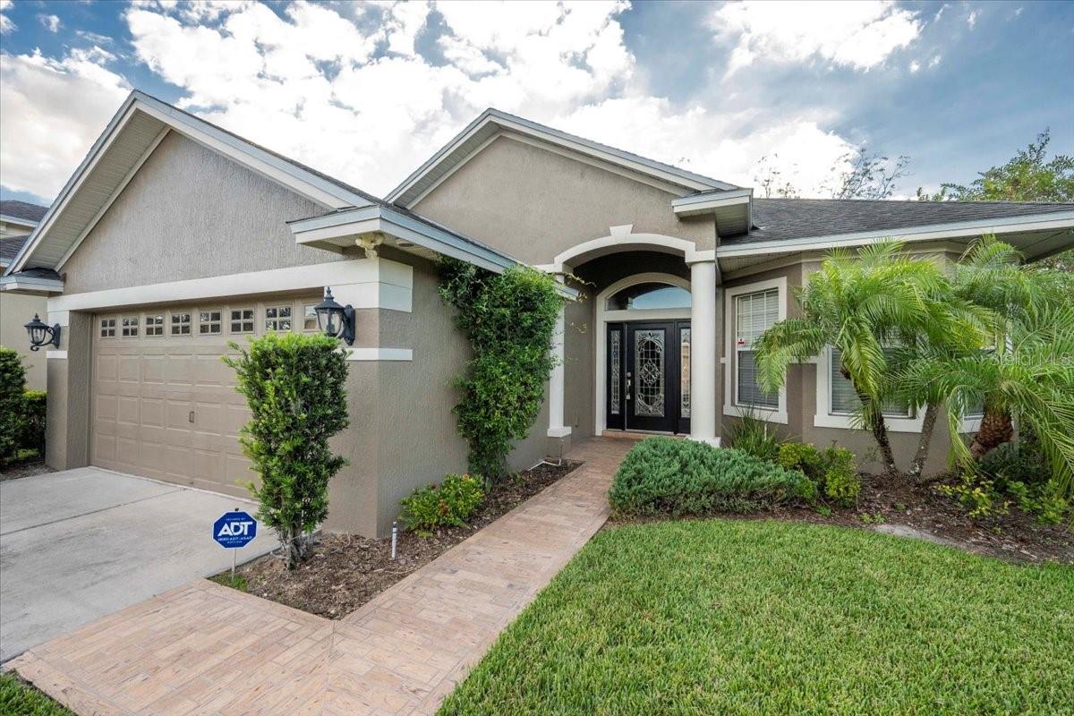 Welcome to 6103 Stoney Creek Way! This 3-bedroom, 2-bath home with an additional office (complete with closet, perfect for a guest room or flex space) offers nearly 2,200 square feet of comfortable living in a desirable gated community.
Built in 2007, this home features an inviting open layout with high ceilings, elegant trim work, and a blend of wood flooring, tile, and brand-new carpet in the bedrooms. Enjoy a spacious kitchen with granite countertops, stainless steel appliances, a large pantry, and a cozy dining area. A separate formal dining room is ideal for entertaining.
The generous primary suite includes a walk-in closet and a luxurious en suite bath with double vanities, a jetted tub, and a separate shower. The interior laundry room adds everyday convenience.
Step outside to the screened back porch overlooking beautifully landscaped grounds—a peaceful space to relax or entertain year-round.
Situated on a corner lot in a well-maintained, gated neighborhood, residents also enjoy access to a community pool and clubhouse. HOA fees cover lawn care & scheduled exterior repainting providing low-maintenance living and peace of mind.
With a freshly painted interior and Brand New AC, this lovely home is move-in ready and filled with thoughtful details. This home perfectly blends comfort, quality, and value in one of South Lakeland’s most desirable communities.