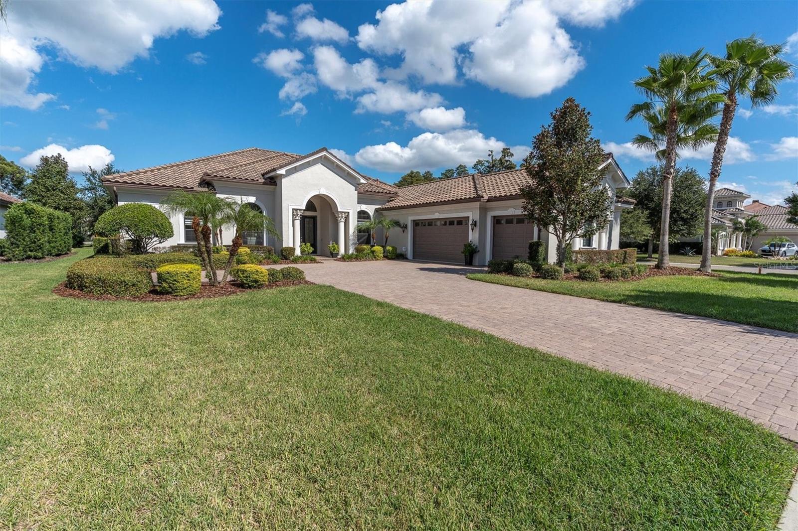 Luxury, Lifestyle, and Lasting Quality in Gated Ladera close to everything Tampa Bay has to offer and in the top school district in the area! Experience refined living in the prestigious gated community of Ladera on Lake Merrywater, a private enclave known for its grand estates, peaceful lake views, and serene setting. Stunning pool oasis in back, set on a beautifully landscaped half-acre corner lot, this 2015 custom-built home blends timeless design with modern comfort and thoughtful craftsmanship. From the moment you arrive, the tile roof, elegant stucco finish, and manicured curb appeal set the tone for what awaits inside. Step through the double-door entry into a grand foyer with 12-foot coffered ceilings, crown molding, and expansive open spaces that flow seamlessly between formal and casual areas. Every detail was carefully chosen and executed with care. The owners left no stone unturned, investing hundreds of thousands of dollars in custom finishes and luxury upgrades throughout. The gourmet kitchen is a showpiece featuring high-end granite countertops, double ovens, gas cooktop with pot filler, built-in microwave, and a prep sink in the large island, all complemented by solid wood cabinetry and a timeless color palette. Entertain with ease in the formal dining room, casual breakfast nook, or spacious family room designed for elegant yet relaxed Florida living. The primary suite, featuring a sliding door and pool views, provides a tranquil retreat with a spa-style bath, dual vanities, and expansive walk-in closets. Additional bedrooms include a Jack-and-Jill suite, a guest room, and a large bonus room with custom-built-ins that provides the perfect flex space for media, play, or an in-law suite with French doors leading to its own private covered lanai overlooking the pool. Enjoy the best of indoor-outdoor living in your private pool and spa surrounded by a travertine deck, sun shelf, fountains, and a screened lanai with two covered lounging areas. The outdoor kitchen is fully equipped with a gas grill, vent hood, side burners, granite counters, bar area, and a beverage fridge, perfect for entertaining year-round. Additional highlights include a Generac whole-home generator, gas tankless water heater, water softener, new interior and exterior paint, new plush luxury carpeting in bedrooms, two new A/C units, exterior landscape lighting, gutters, and a fully fenced backyard. The three-car garage features a finished floor, ample storage, and gas and electric connections in the finished laundry room, which includes a large folding counter and extensive cabinetry. Ladera offers a rare sense of tranquility with no CDD fees, a community dock for fishing and kayaking, and walking paths along the lake. Ideally located near top-rated schools, shopping, and dining with easy access to major highways, this home offers the perfect blend of luxury and convenience. 1403 Merry Water Drive is more than a home; it is a statement of craftsmanship, care, and comfort, designed for those who appreciate the finer things in life. Zoned for Steinbrenner High School, Buchanan Middle School, and Lutz Elementary. Shopping, medical, beaches, close by! No CDD. Hurricane shutters included. This home was unaffected by any hurricanes in the area. For more information, bit.ly/1403MerryWater