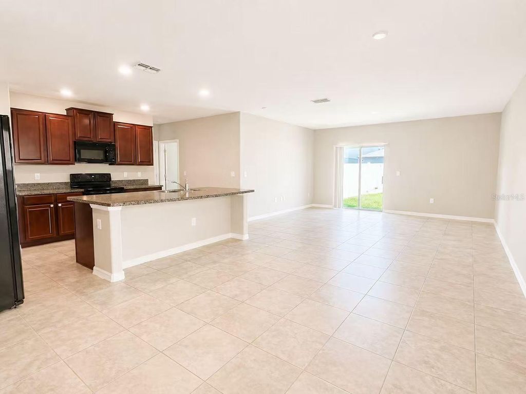 Photo of 7406 Rosy Periwinkle Court, Tampa, FL 33619 (MLS # TB8501969)