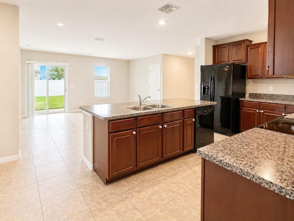 Photo of 7406 Rosy Periwinkle Court, Tampa, FL 33619 (MLS # TB8501969)