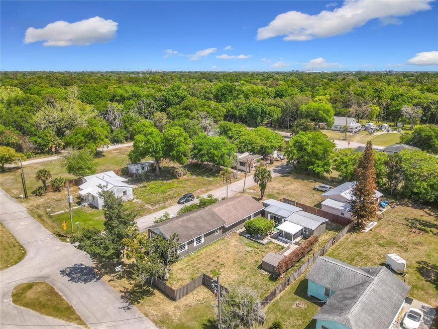 Stunningly updated home on a large corner lot in the heart of New Smyrna Beach! This property features brand new vinyl flooring throughout, freshly painted interior and exterior, and a fully renovated kitchen with new cabinets. The master bathroom has a new shower, and every detail has been refreshed for a move-in ready experience. 5th room that can be used as an office or additional bedroom.

The property also includes a guest house with amazing multigenerational potential—perfect as a mother-in-law suite, duplex, or rental—featuring a new tile shower. Enjoy the privacy and versatility this setup provides, ideal for extended family or rental income opportunities.

Located just minutes from the river and US-1 corridor, this home combines convenience, style, and potential in one unbeatable package. Don’t miss this opportunity to own a beautifully updated home with multiple living options on a spacious corner lot!