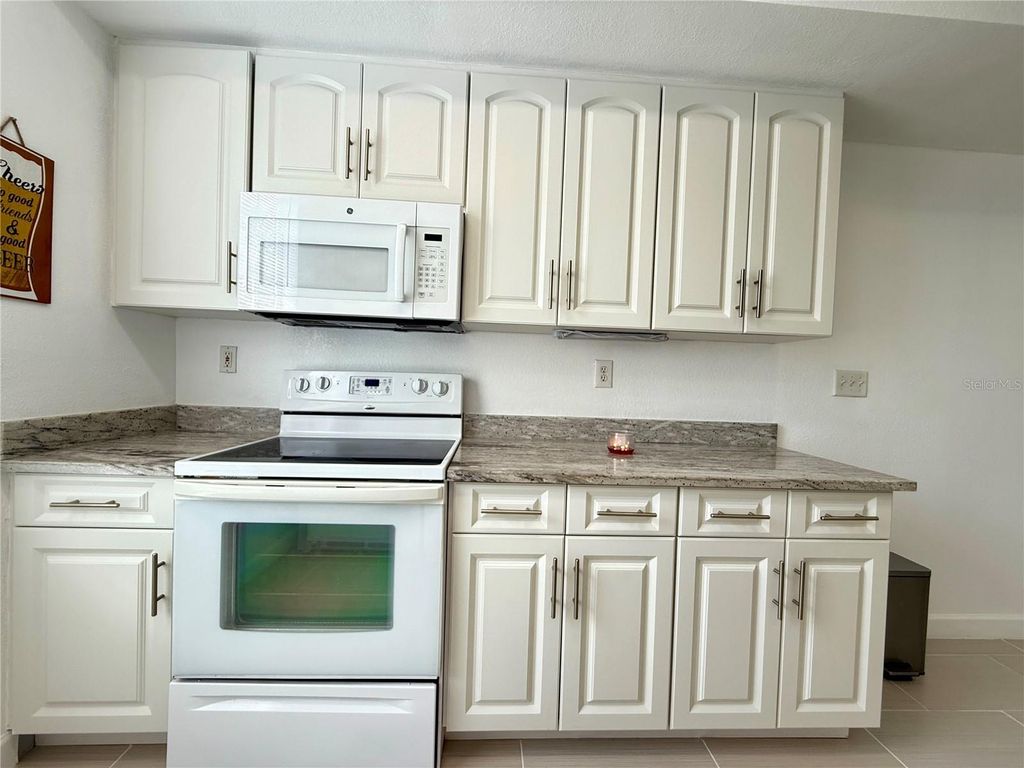 Photo of 9650 Lake Chase Island Way #9650, Tampa, FL 33626 (MLS # TB8376684)