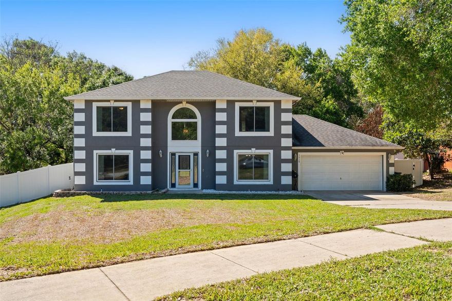 This beautifully updated 3-bedroom, 2.5 bathroom home with two bonus rooms is located in the community of Pine Bluff, just a short walk to the Minneola Athletic Complex and conveniently close to the Florida Turnpike, hospitals, schools, and shopping. This home features a spacious oversized garage, large fenced backyard with mature trees, and a screened and covered patio. Inside, you’re welcomed by a spacious foyer with cathedral ceilings, a formal dining room, a versatile flex space ideal for a home office or gym, and a convenient half-bathroom. The open-concept kitchen and living area includes an island, two pantries, stainless steel appliances, and an adjacent laundry closet. Upstairs, the oversized primary suite offers a walk-in closet and en-suite bathroom with garden tub, walk-in shower, and dual vanity. Two additional bedrooms, a full bath, and a loft-style bonus room round out the second floor. Recent upgrades include: Hardie board siding, Optimax® performance hybrid vinyl flooring throughout the whole home, sleek modern baseboard, stylish glass inlay front door, and new windows, screens, and sliding glass door with a transferable warranty. ALL appliances convey. Meticulously maintained and thoughtfully updated, this home is move-in ready for its next owner! Complete upgrade list available upon request.