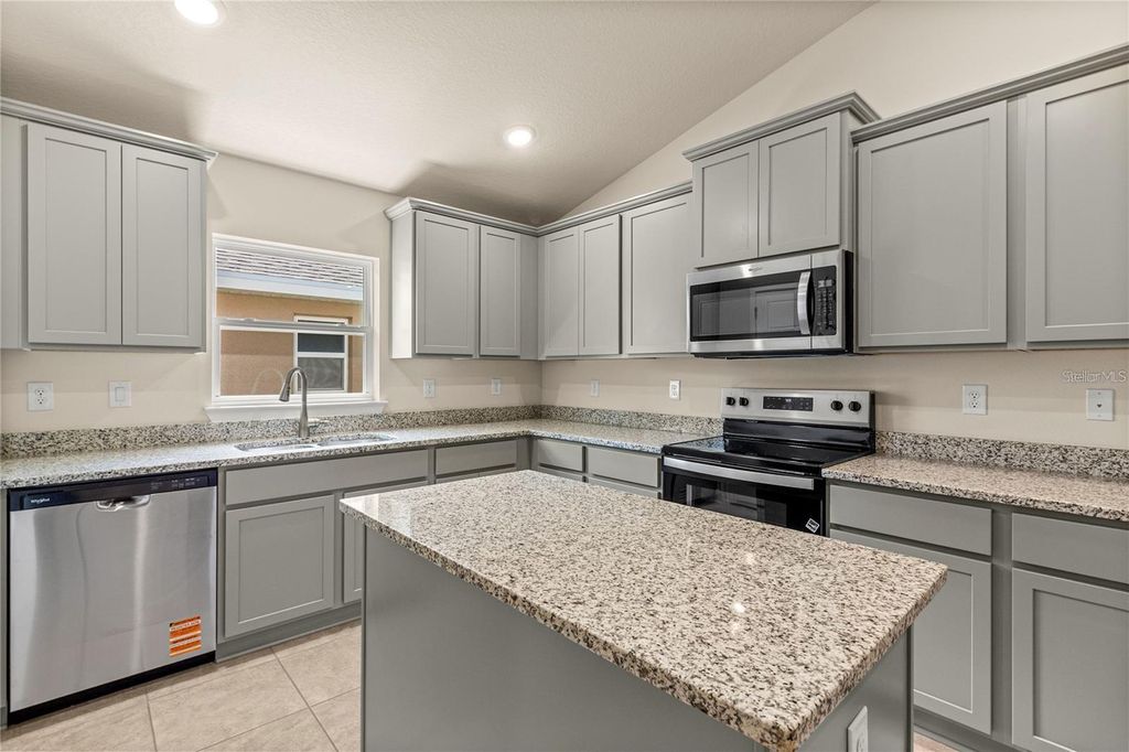 Photo of 1667 Ann Rose Way, Leesburg, FL 34748 (MLS # O6423156)
