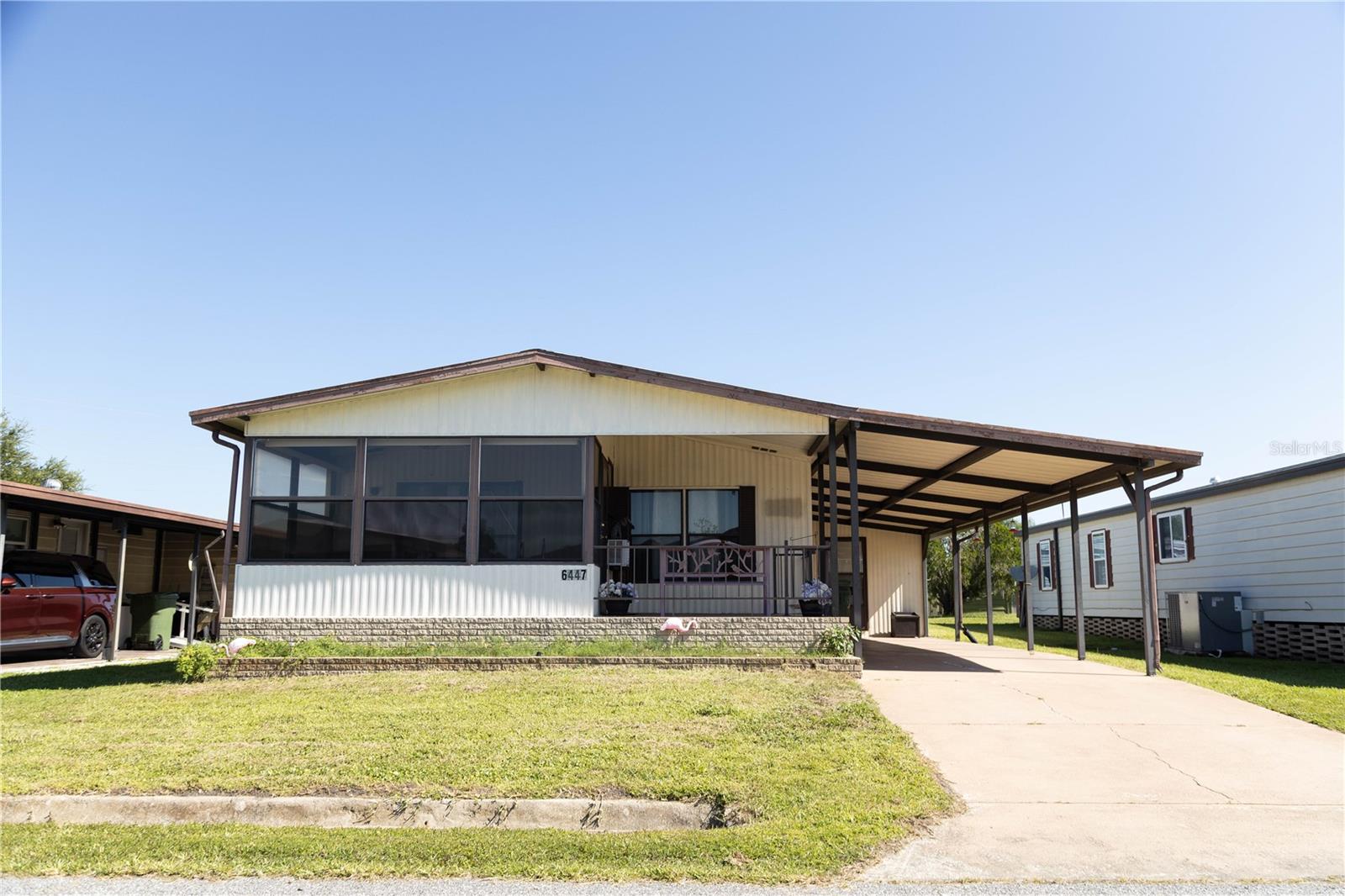 Great home located in the 55+ community of Brookhaven Village. Water, sewer & trash Included for only $34/month. The activities calendar stays full and there is always a friend when you need one. This home boasts 2 porches to enjoy as well as a 2022: ROOF ----2022 Air Conditioner -2022: Lanai Addition----2022: Refrigerator -- Covered carport with 2 Spaces--NO FLOOD ZONE- ---Winter Haven does not experience damage from severe weather, flooding or hurricaines -4 miles from tons of shopping and restaurants 6 miles from Downton Winter Haven! 28 miles from the Lakeland Airport- 21 miles from Disney World - 10 Miles from LEGOLAND