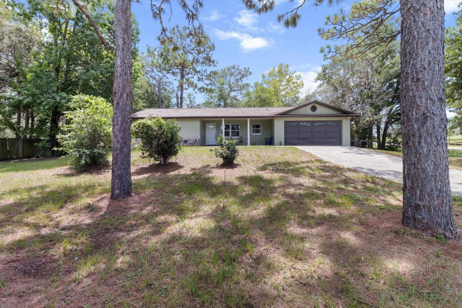 DON'T LET THE AGE FOOL YOU! This home has had a total makeover and shows like brand new! Enjoy country living in Circle M Ranchettes, sitting high above the road on the front porch with easy access to downtown Dunnellon, for dining on the two rivers or stroll the quaint shops in the historic area of town. Check out the World Equestrian Center within 30 minutes with dining, shops and many types of equestrian, dog & music shows & more. This home sits on .91 of an acre with fenced in back yard. The entire home was remodeled with new kitchen with soft-close doors, granite tops & stainless steel appliances. The 2 baths have also been totally remodeled. Other great features are split bedroom floor plan for privacy, luxury vinyl flooring throughout, new windows, painted inside & out, new roof & septic. All you need to do is add your personal touches. All This located just a few miles to downtown Dunnellon which offers quaint shops & dining on & off the water. There are 2 rivers that flow thru Dunnellon. Enjoy tubing, boating & swimming on the crystal clear Rainbow River known for it's 72 degree year round water temperatures or checkout the boating & fishing on the Withlachoocee river that flows into Lake Rousseau. If your looking for more outdoor activities, jump on the 49 miles of Paved trails in Dunnellon & runs all the way to Floral City. If the Gulf of Mexico is your jam, just drive about 15 minutes in the other direction to the town of Crystal River that also offers great shopping & dining along with swimming with the famous manatees, boating & fishing and access to the Gulf of Mexico. Come to Dunnellon and enjoy our great living!